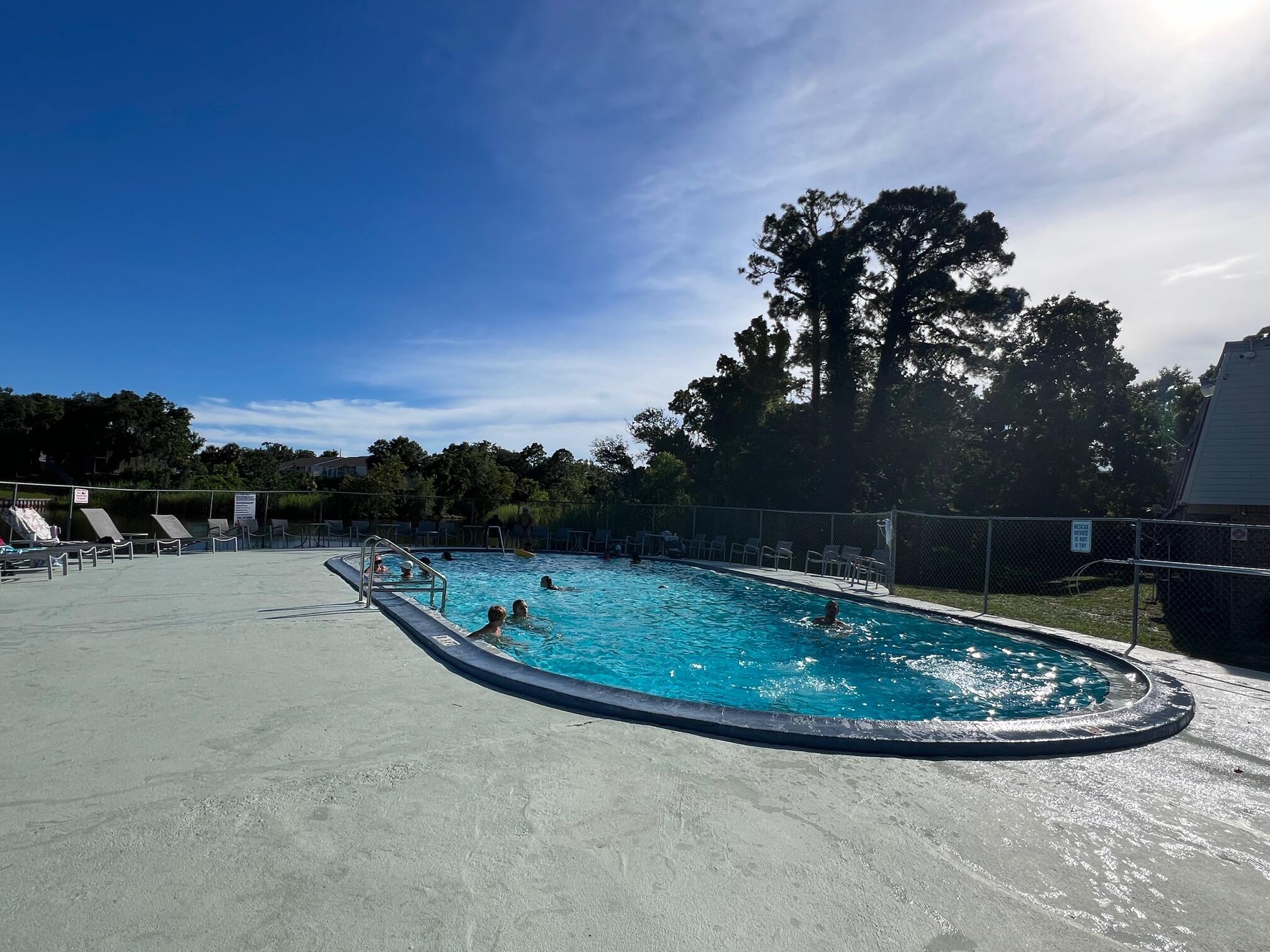 210 Pelham Road, Unit 105B Fort Walton Beach, FL 32547 - Photo 5 of 41 a view of a swimming pool with a yard