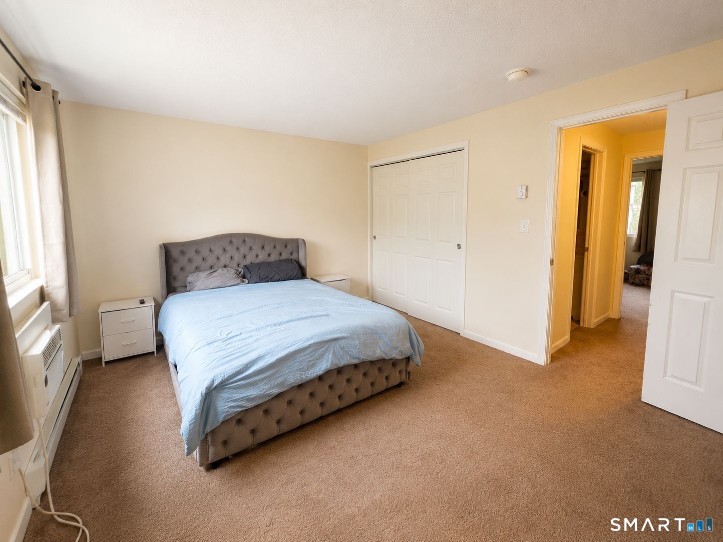 461 Spring Street, Unit 1A Naugatuck, CT 06770 - Photo 13 of 17 a bedroom with a bed and a window