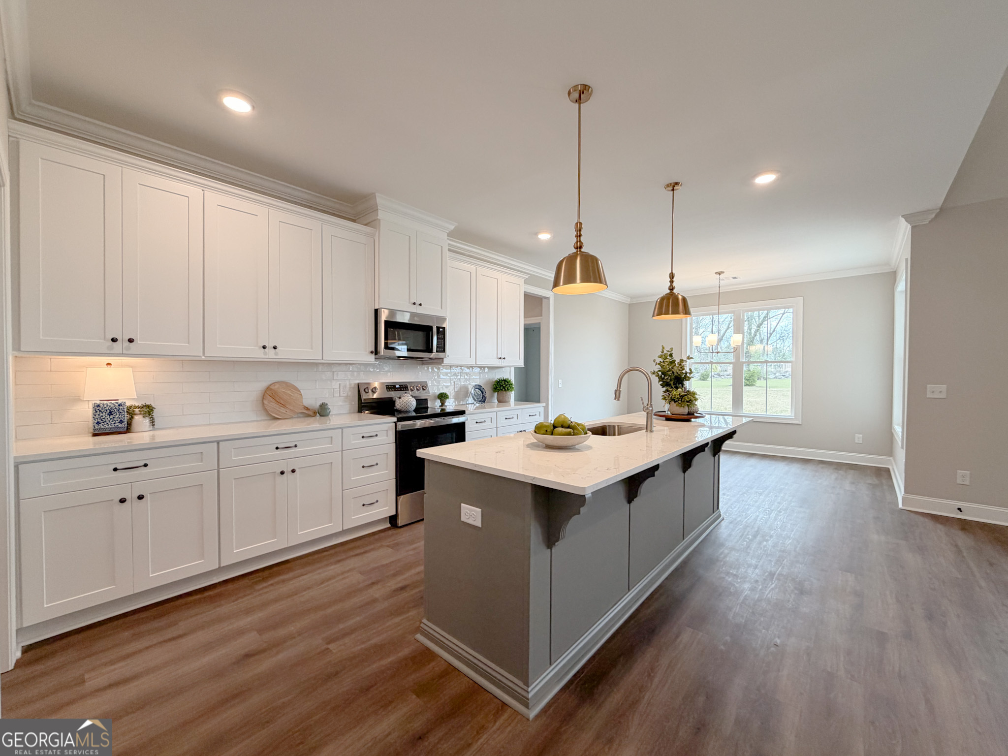 9 Honeysuckle Way Claxton, GA 30417 - Photo 13 of 84 a kitchen with a sink window and stainless steel appliances