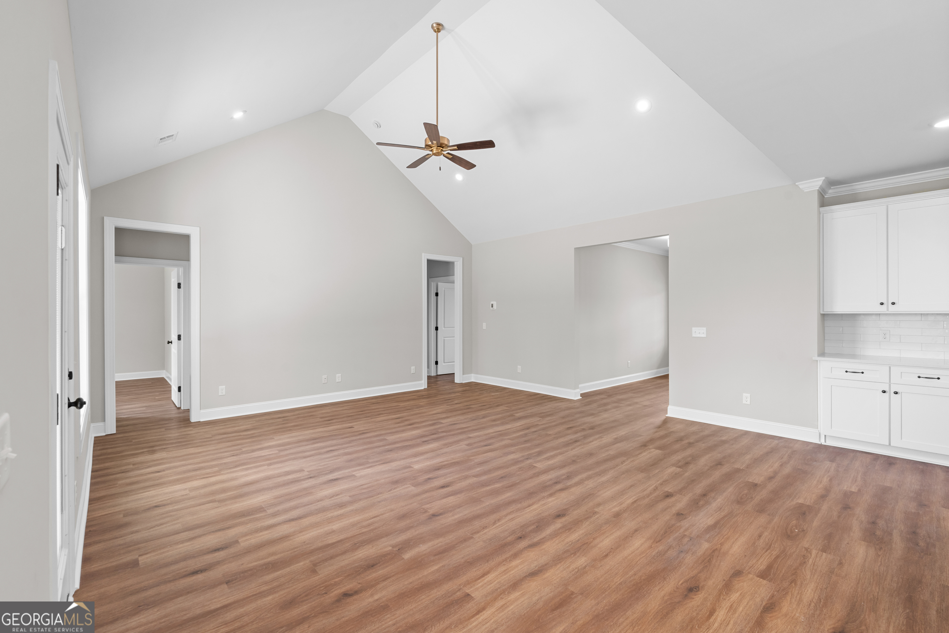 9 Honeysuckle Way Claxton, GA 30417 - Photo 14 of 84 a view of empty room with wooden floor and ceiling fan