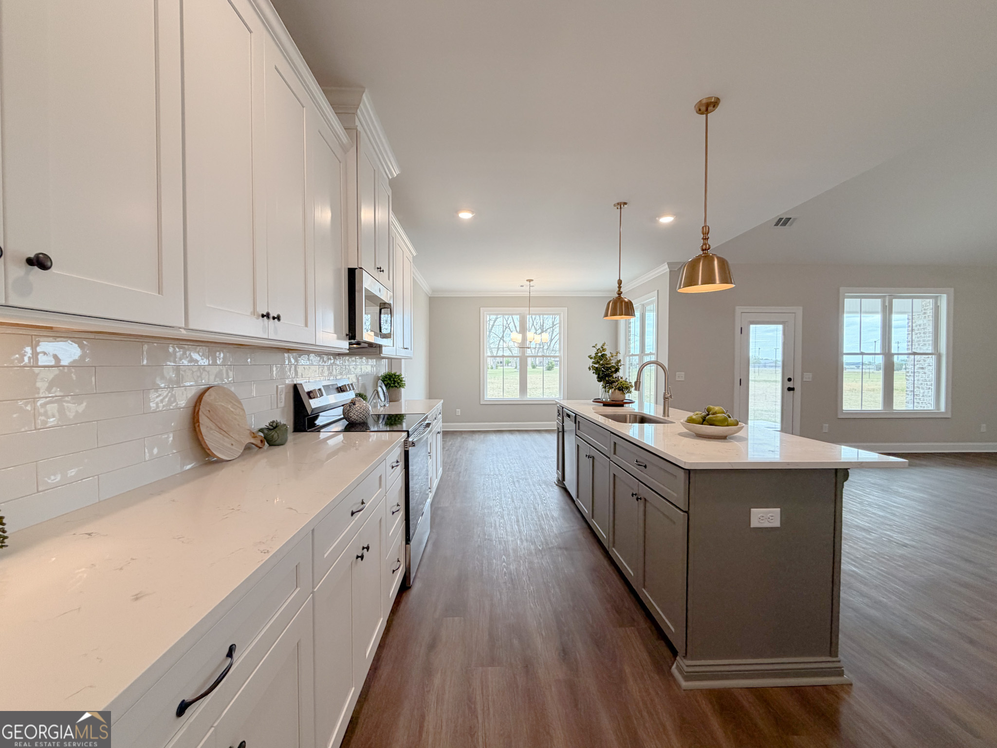 9 Honeysuckle Way Claxton, GA 30417 - Photo 16 of 84 a large kitchen with stainless steel appliances granite countertop a lot of counter space