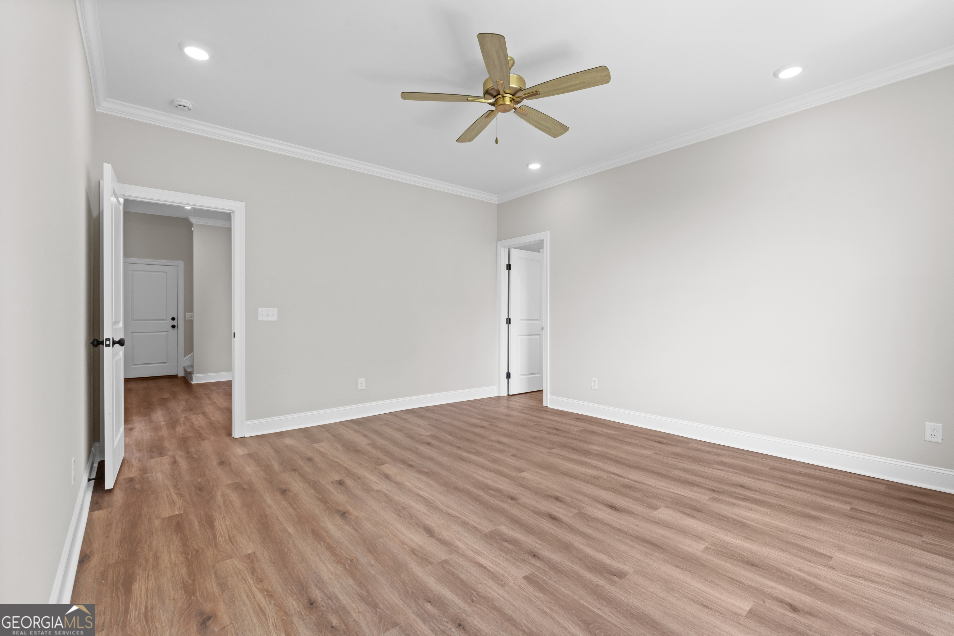 9 Honeysuckle Way Claxton, GA 30417 - Photo 19 of 46 wooden floor in an empty room with a window