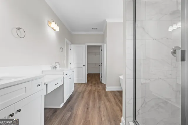 a view of a room with wooden floor