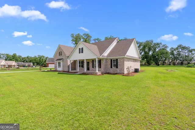 a view of a house with a big yard