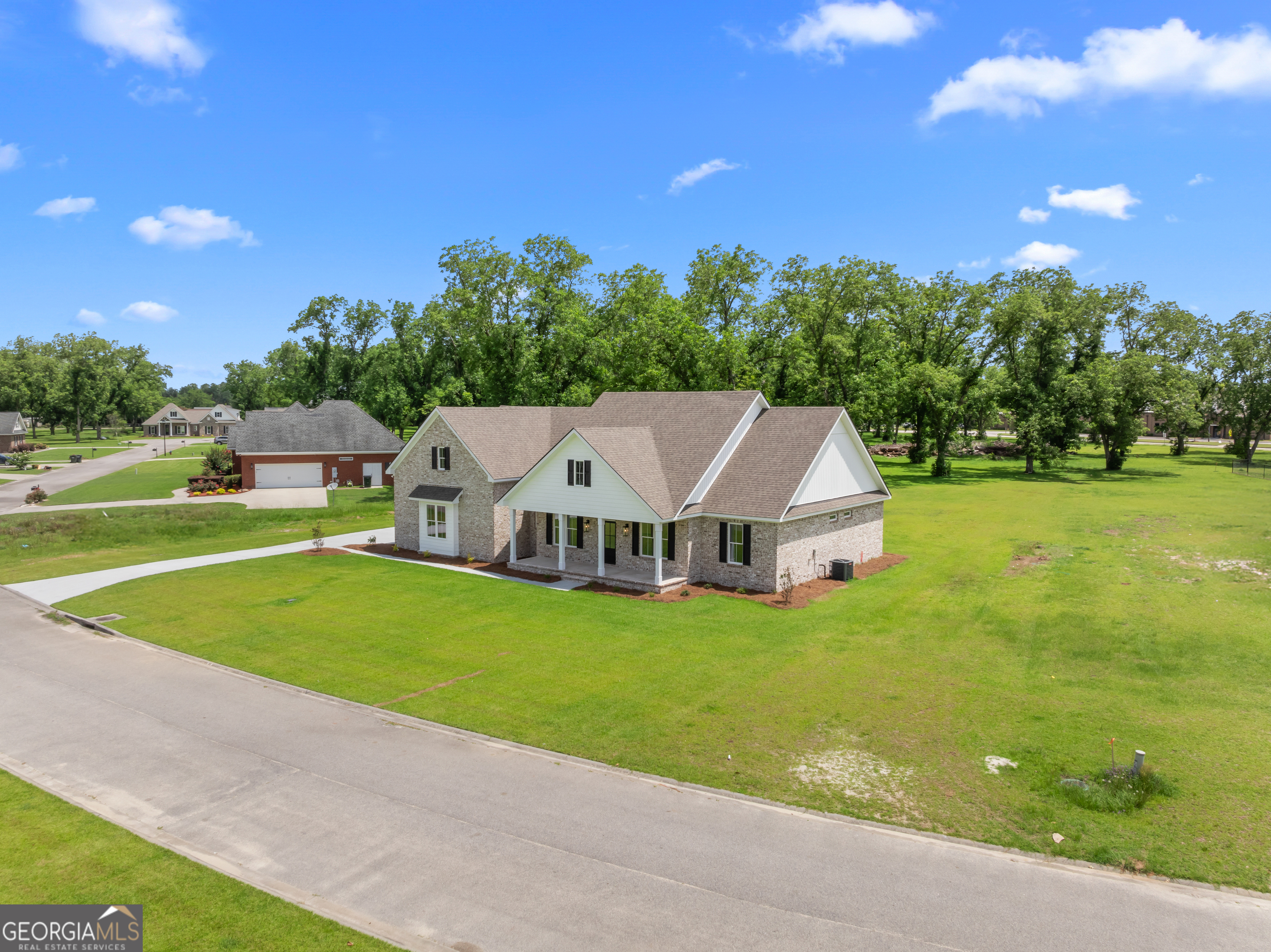 9 Honeysuckle Way Claxton, GA 30417 - Photo 2 of 84 a view of a big house with a big yard and large trees