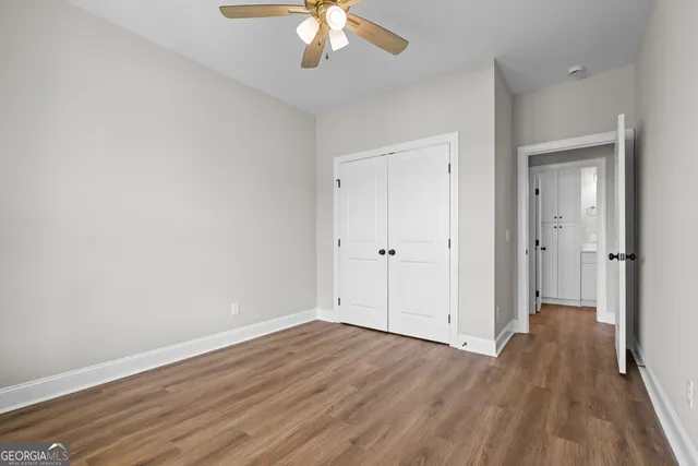 an aerial view of a house with a garden and swimming pool