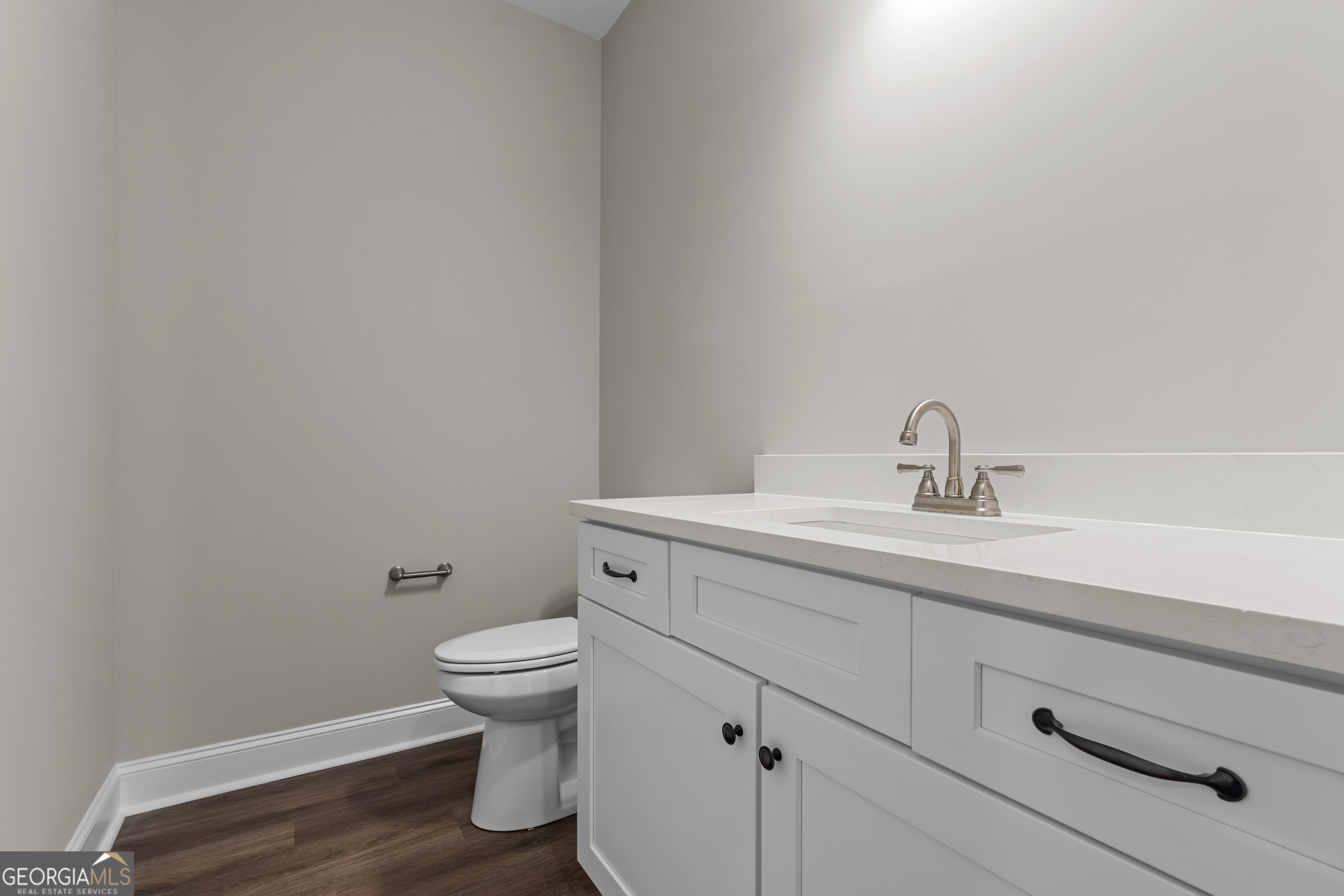 9 Honeysuckle Way Claxton, GA 30417 - Photo 33 of 46 a bathroom with a sink a toilet and a mirror