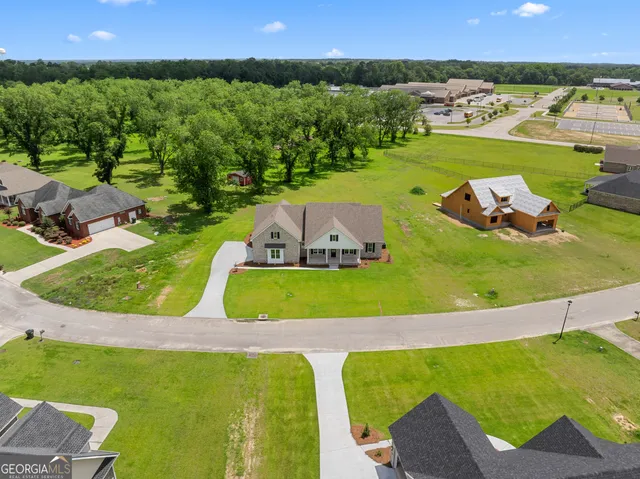 a front view of a house with a yard table and chairs