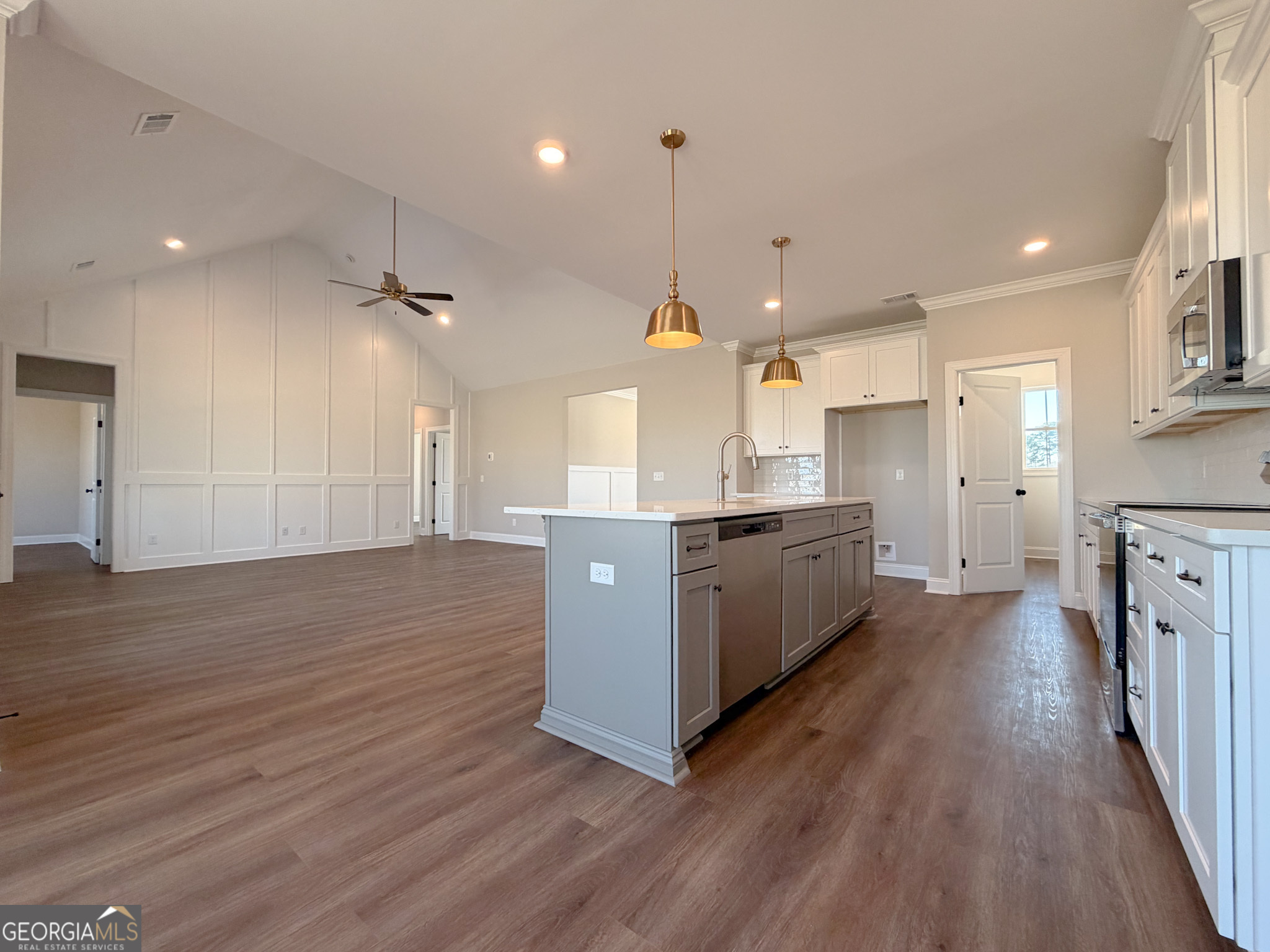 9 Honeysuckle Way Claxton, GA 30417 - Photo 36 of 84 a large kitchen with a large counter top a sink stainless steel appliances and cabinets