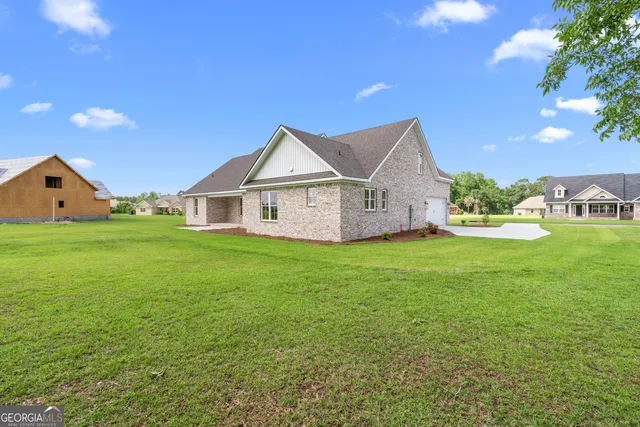 a view of a house with a big yard