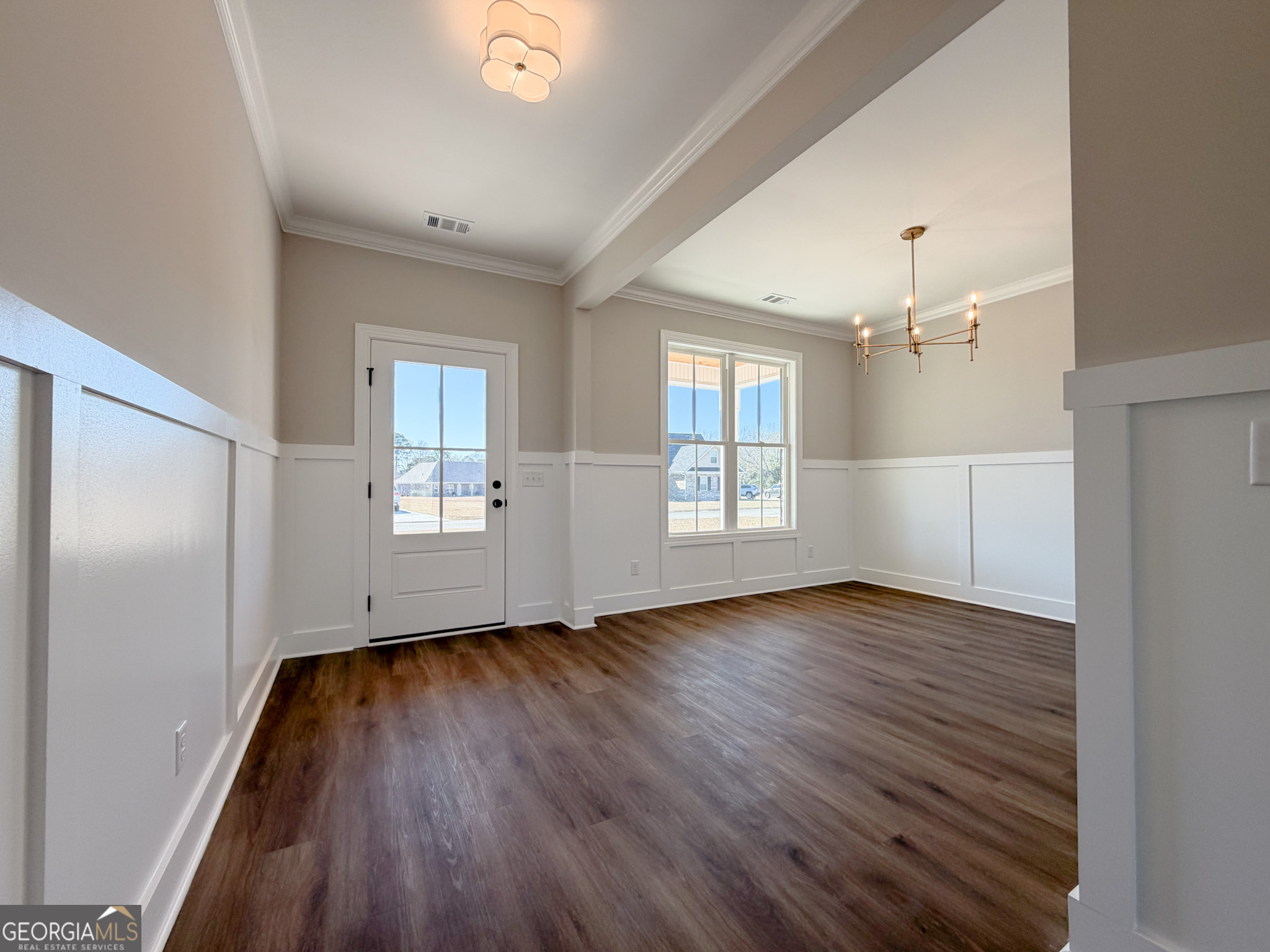 9 Honeysuckle Way Claxton, GA 30417 - Photo 45 of 84 an empty room with wooden floor and windows