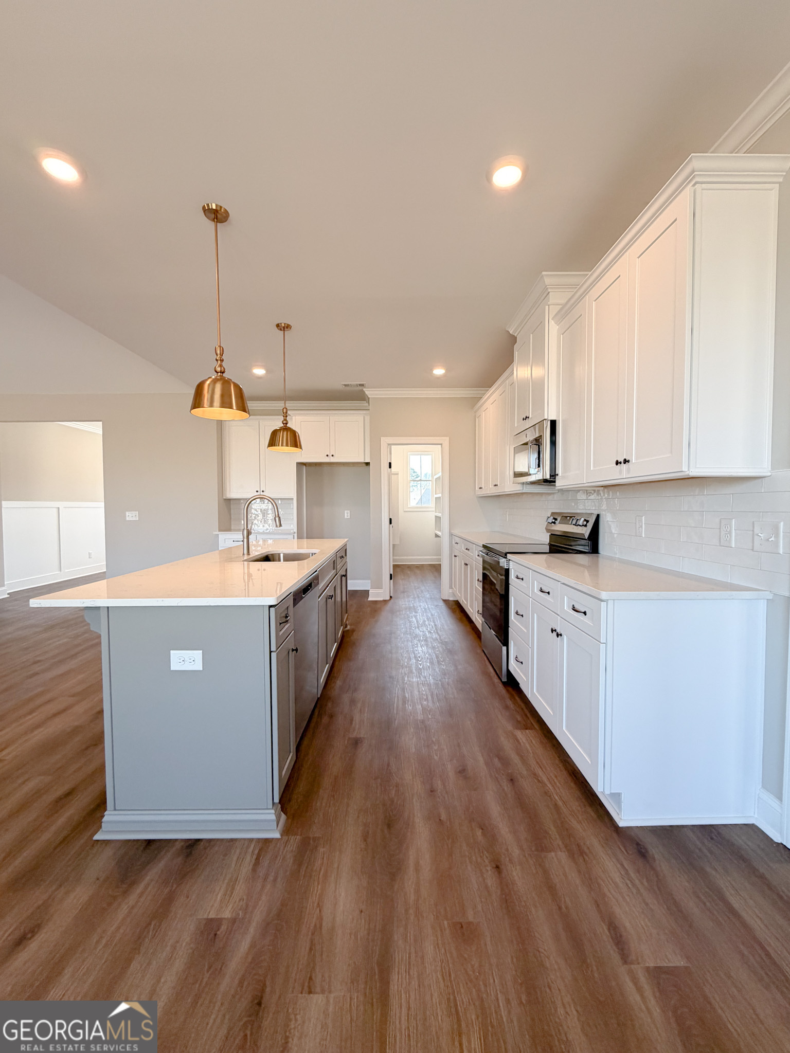 9 Honeysuckle Way Claxton, GA 30417 - Photo 46 of 84 a large kitchen with stainless steel appliances sink a microwave and cabinets
