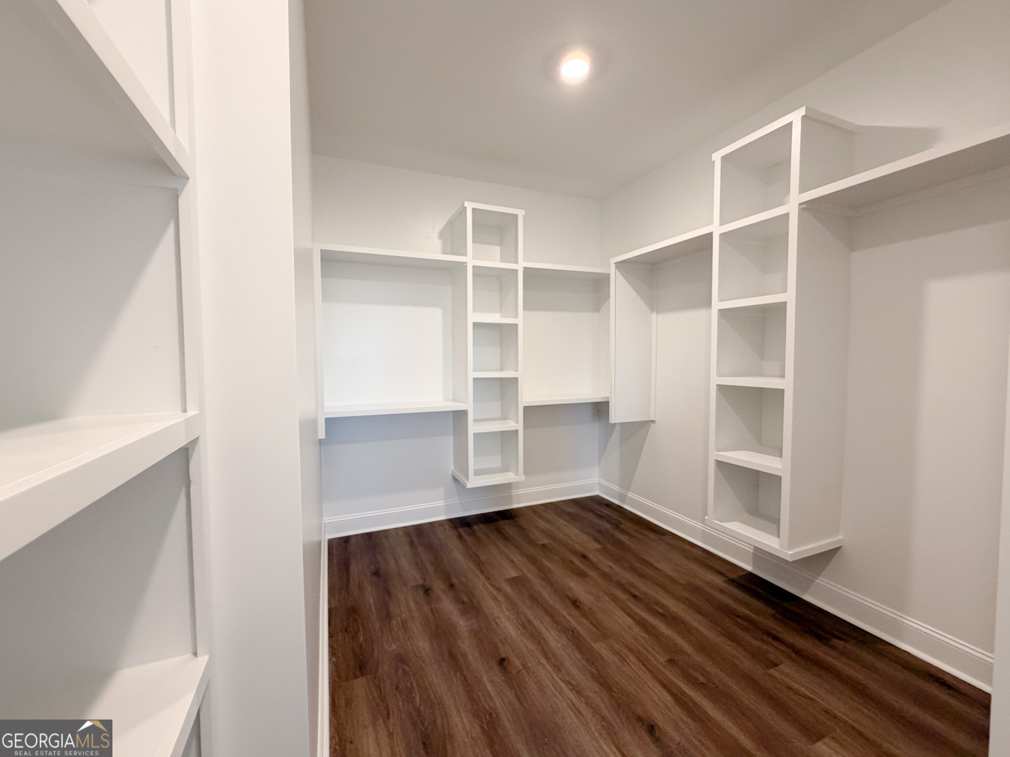 9 Honeysuckle Way Claxton, GA 30417 - Photo 57 of 84 a view of an empty room with a window and wooden floor