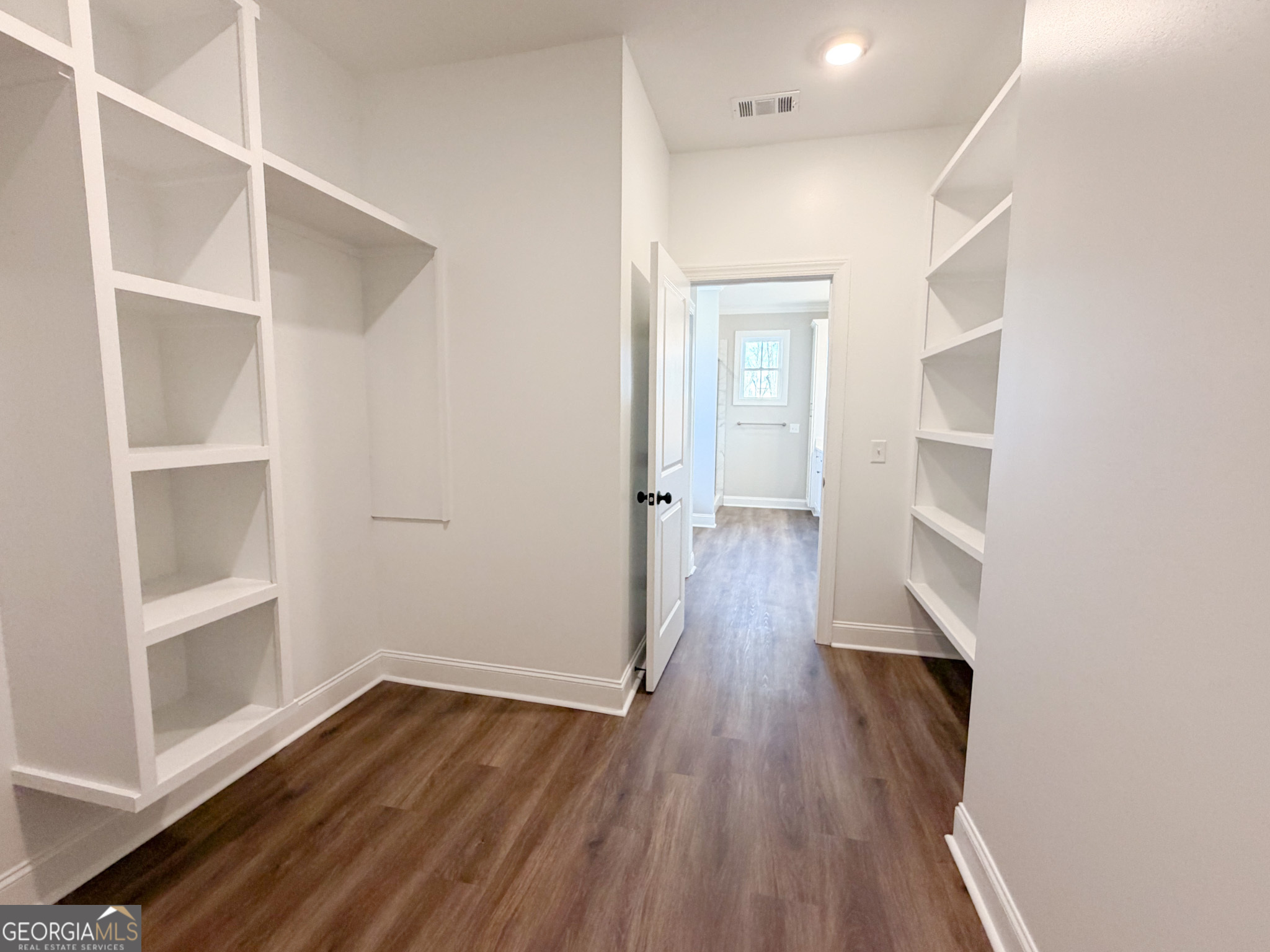 9 Honeysuckle Way Claxton, GA 30417 - Photo 58 of 84 an empty room with wooden floor and closet