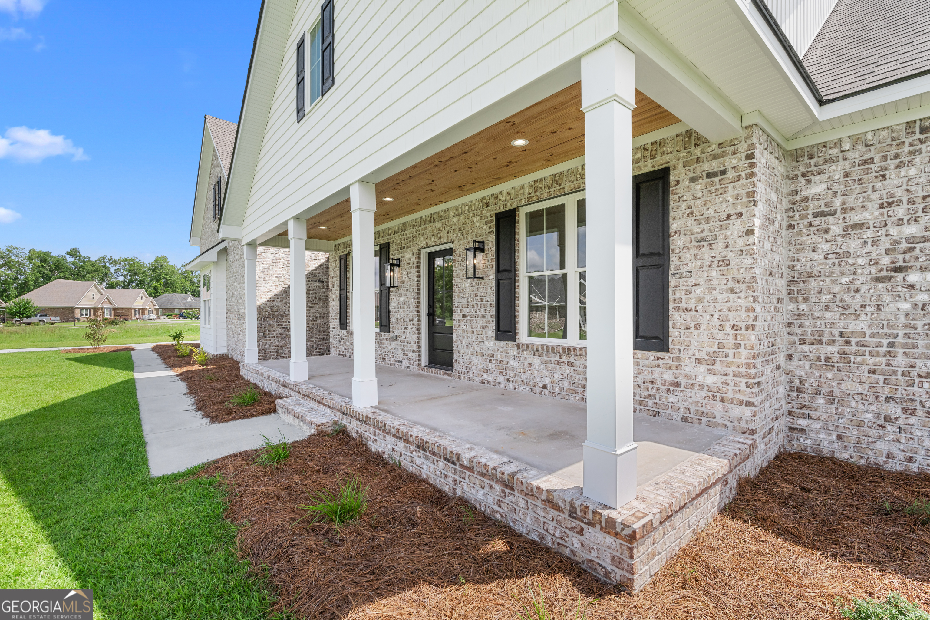 9 Honeysuckle Way Claxton, GA 30417 - Photo 6 of 46 a view of a brick house with a large windows