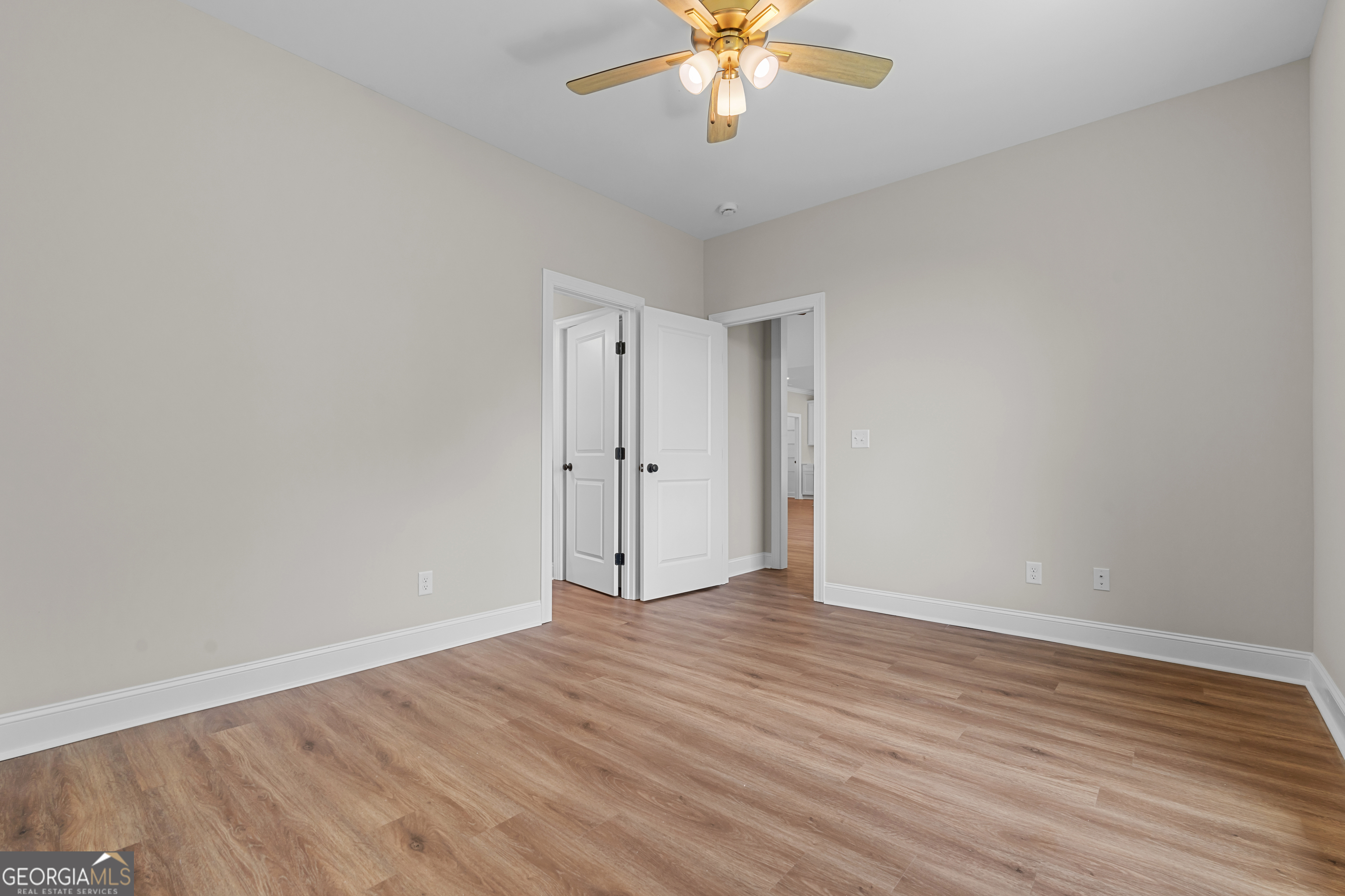 9 Honeysuckle Way Claxton, GA 30417 - Photo 68 of 84 a view of an empty room with wooden floor