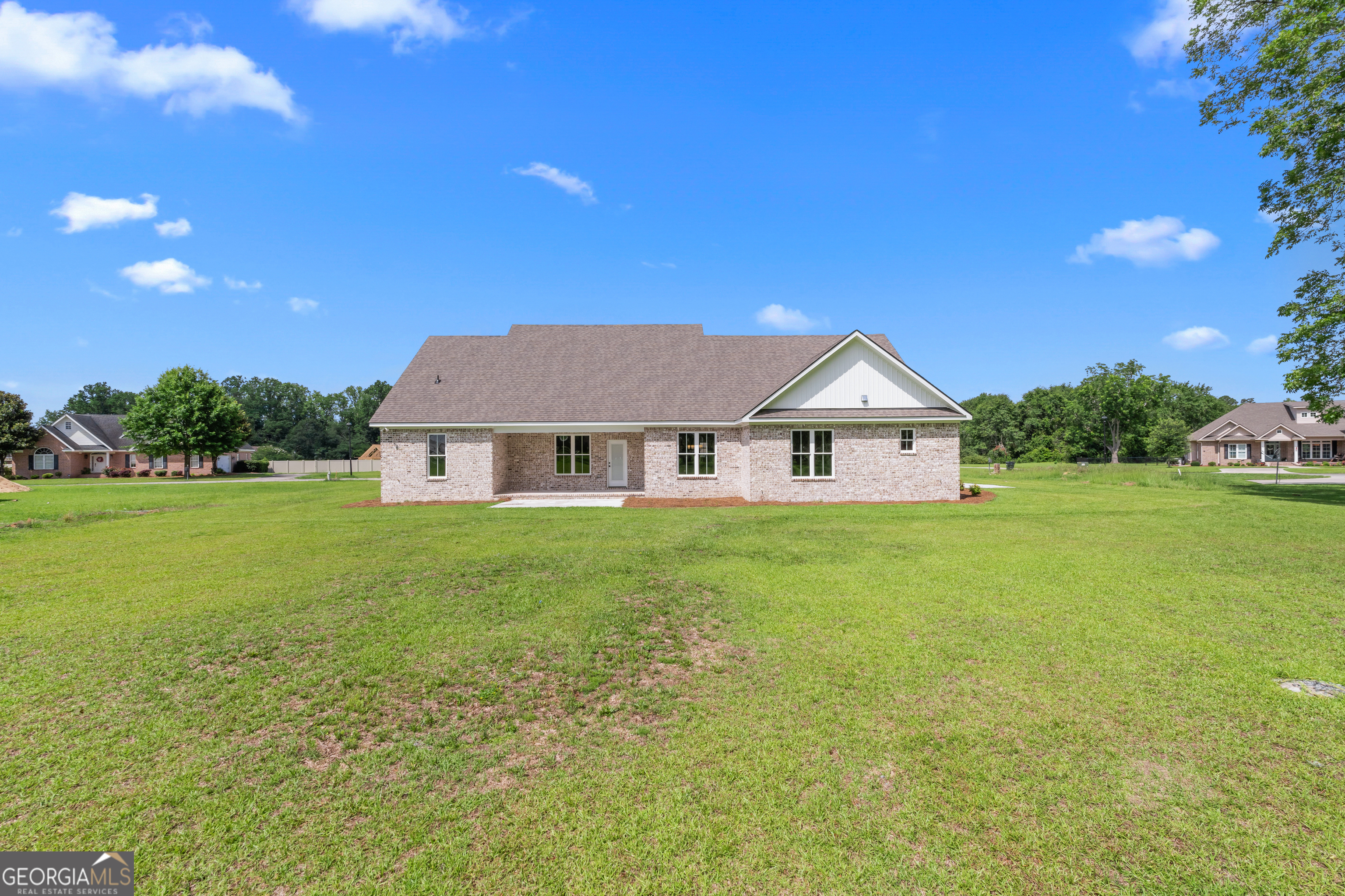 9 Honeysuckle Way Claxton, GA 30417 - Photo 80 of 84 a view of a house next to a big yard with plants and large trees