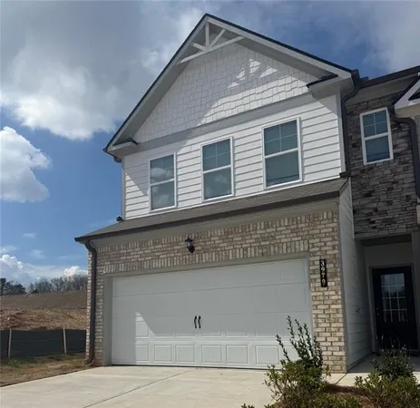 a front view of a house with a garage
