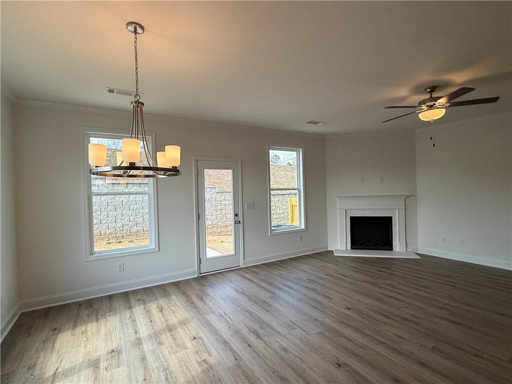 3979 Streamlet Way, Unit 153 Gainesville, GA 30506 - Photo 7 of 17 a view of an empty room with a window and fireplace
