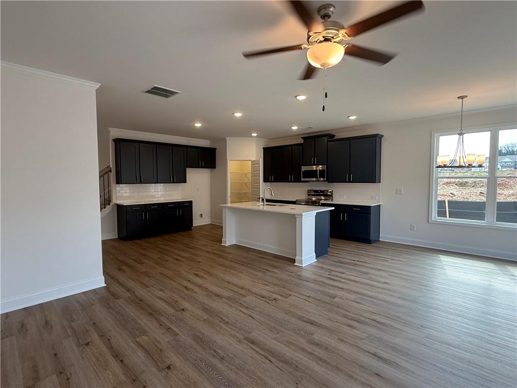 3979 Streamlet Way, Unit 153 Gainesville, GA 30506 - Photo 9 of 17 a view of kitchen with sink microwave and stove top oven