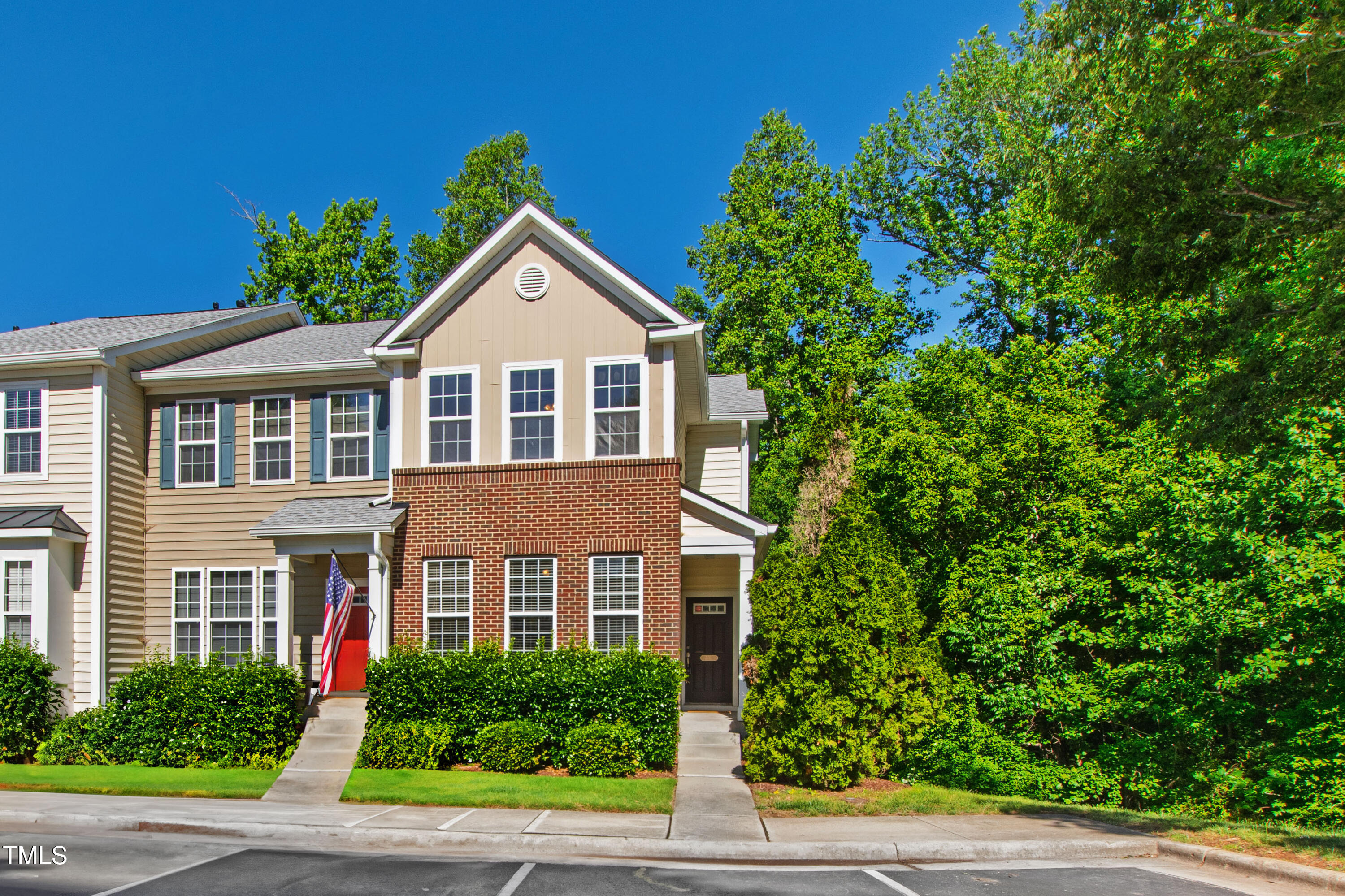 7761 Winners Edge Street Raleigh, NC 27617 - Photo 1 of 44 a front view of a house with a yard and trees