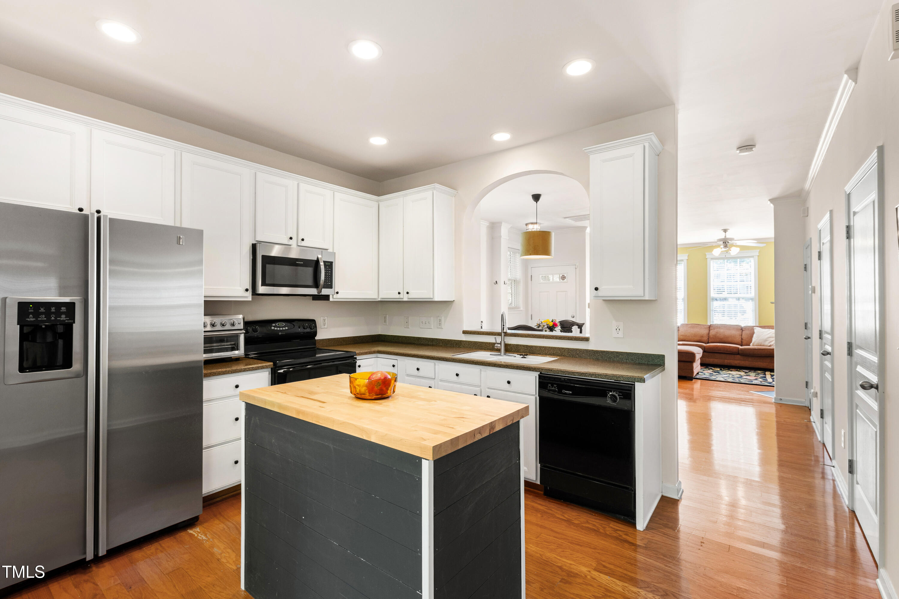 7761 Winners Edge Street Raleigh, NC 27617 - Photo 15 of 44 a kitchen with a sink stove and refrigerator