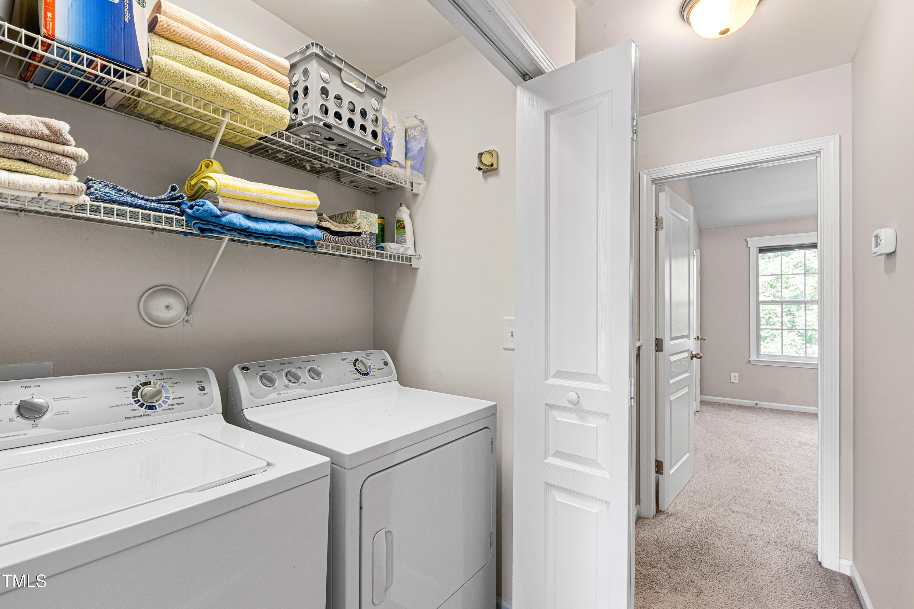7761 Winners Edge Street Raleigh, NC 27617 - Photo 18 of 44 a utility room with dryer and washer