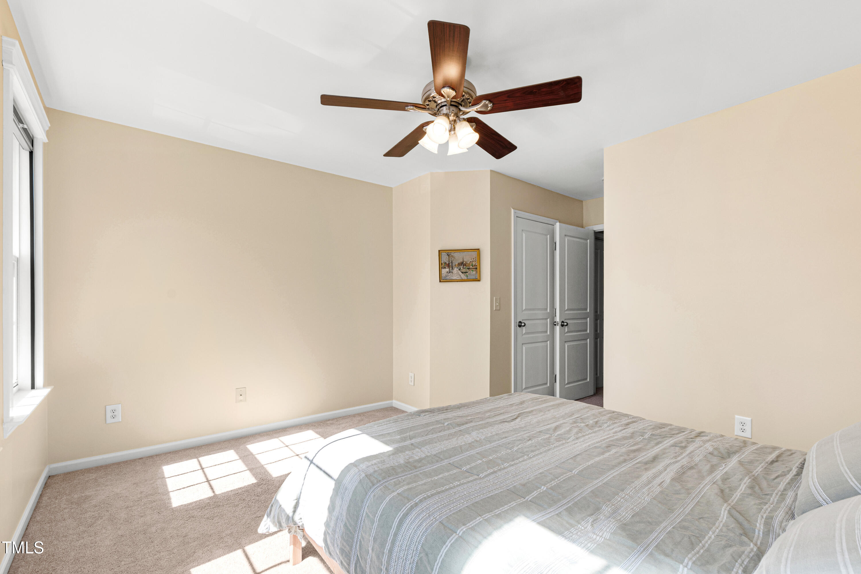 7761 Winners Edge Street Raleigh, NC 27617 - Photo 20 of 44 a bedroom with a bed and a window