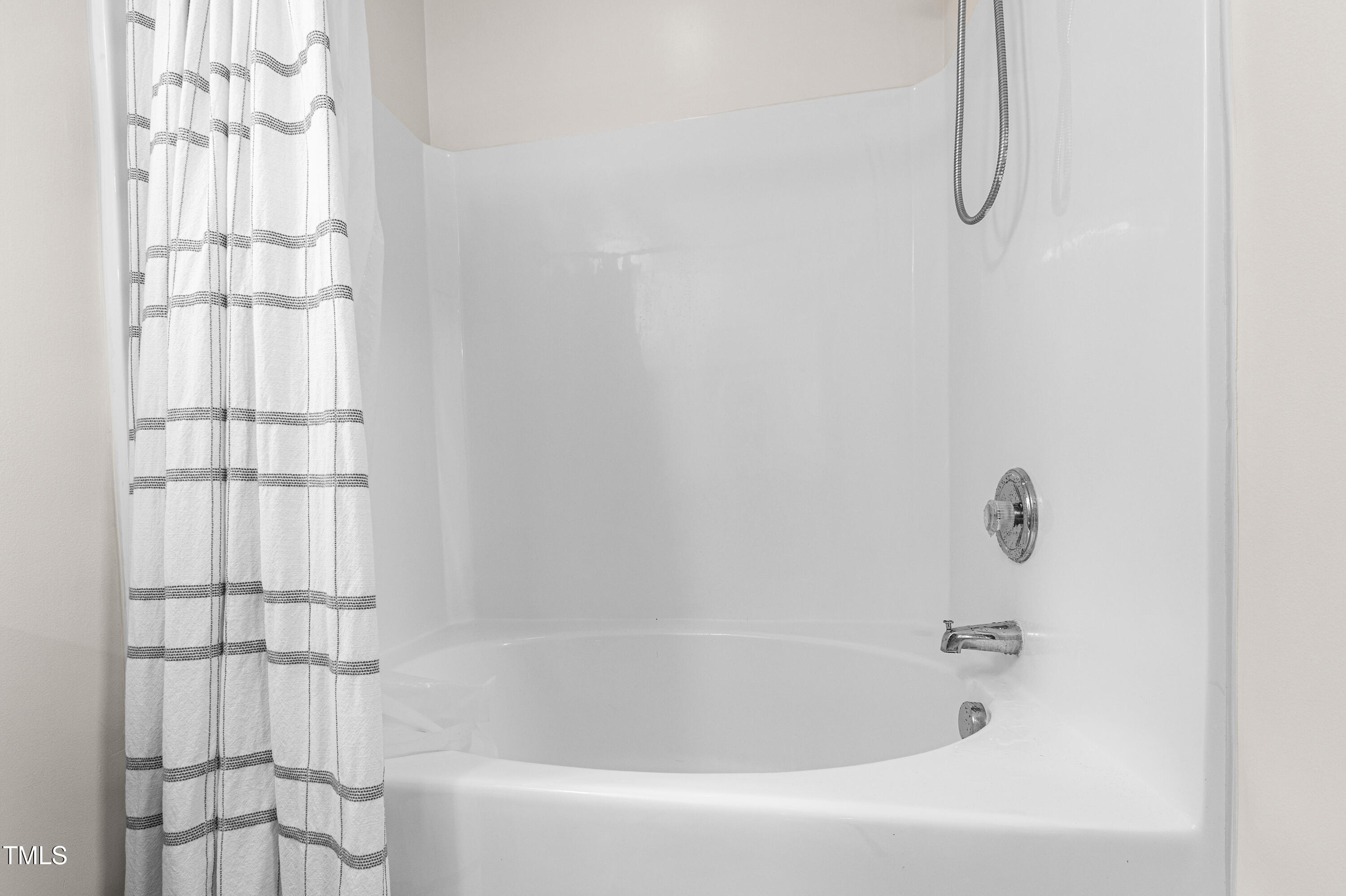 7761 Winners Edge Street Raleigh, NC 27617 - Photo 27 of 44 a bathroom with a bath tub with a shower