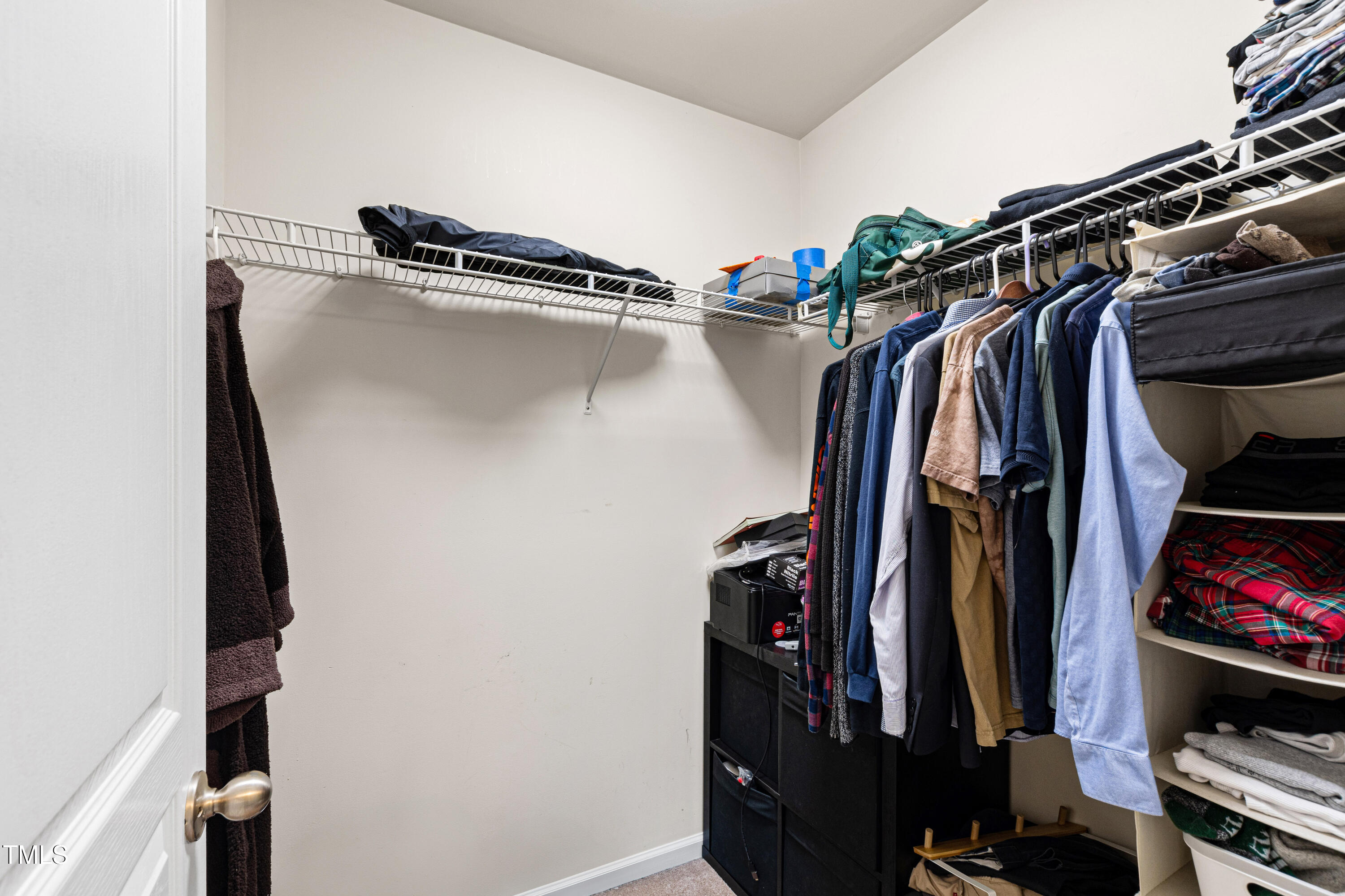 7761 Winners Edge Street Raleigh, NC 27617 - Photo 28 of 44 a view of walk in closet with clothes and shoes