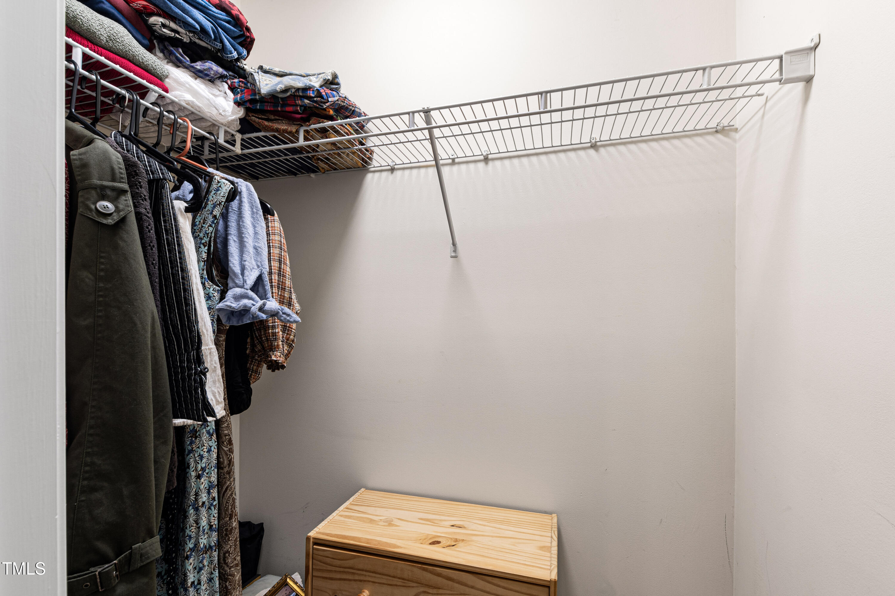 7761 Winners Edge Street Raleigh, NC 27617 - Photo 29 of 44 a view of walk in closet with clothes and shoes