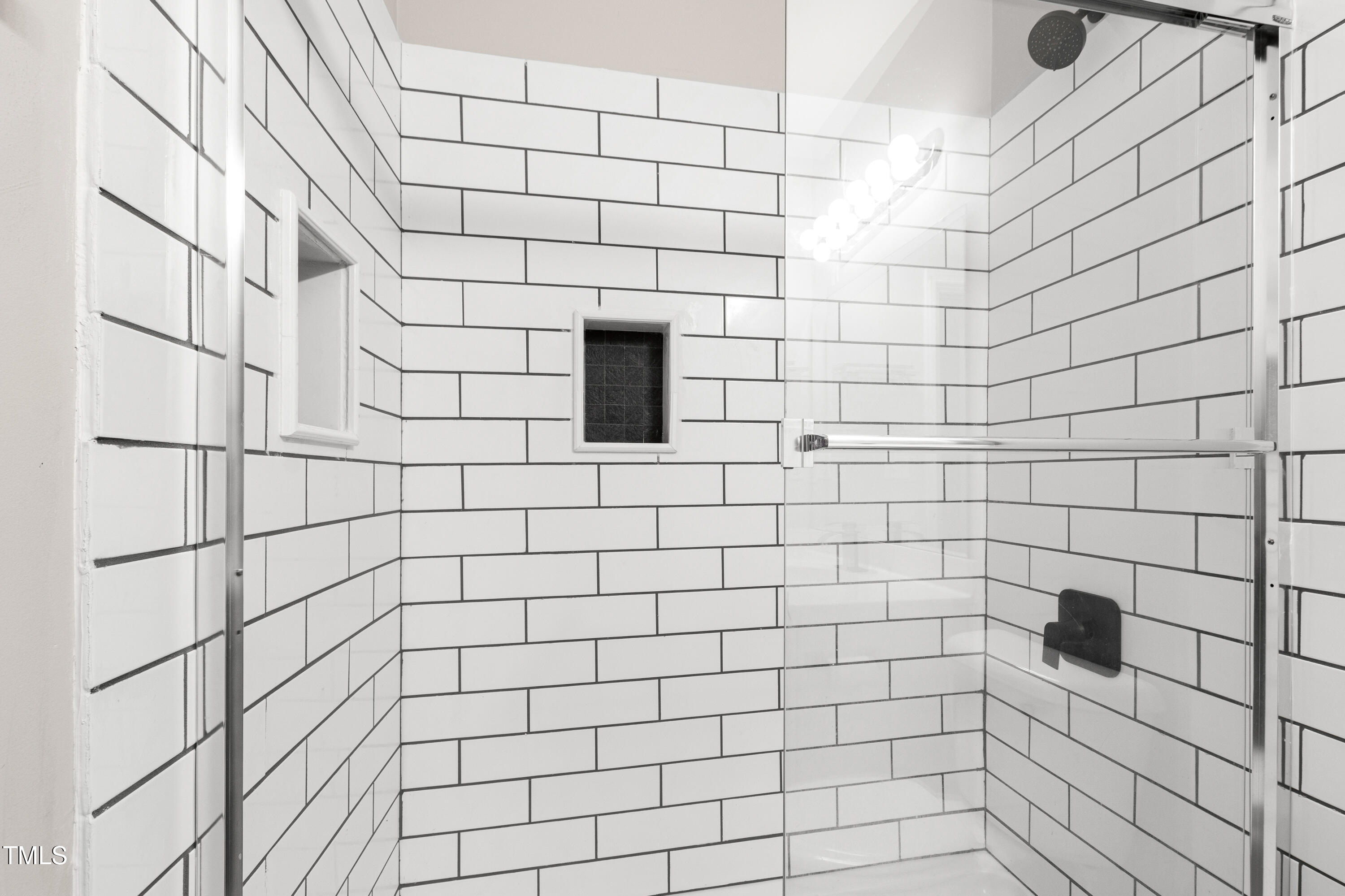7761 Winners Edge Street Raleigh, NC 27617 - Photo 34 of 44 a bathroom with a shower