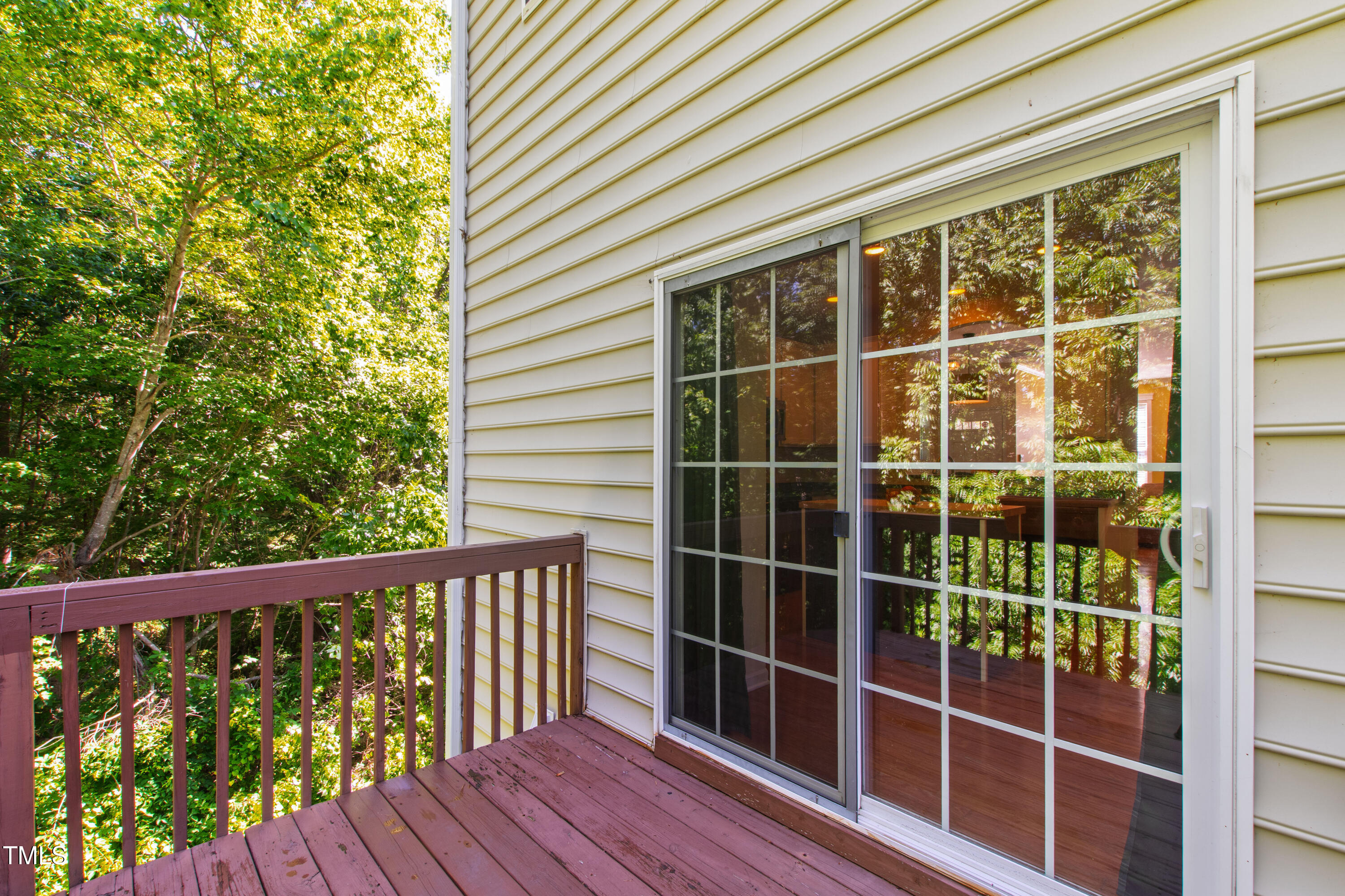 7761 Winners Edge Street Raleigh, NC 27617 - Photo 37 of 44 a view of a balcony with a floor to ceiling window and wooden floor