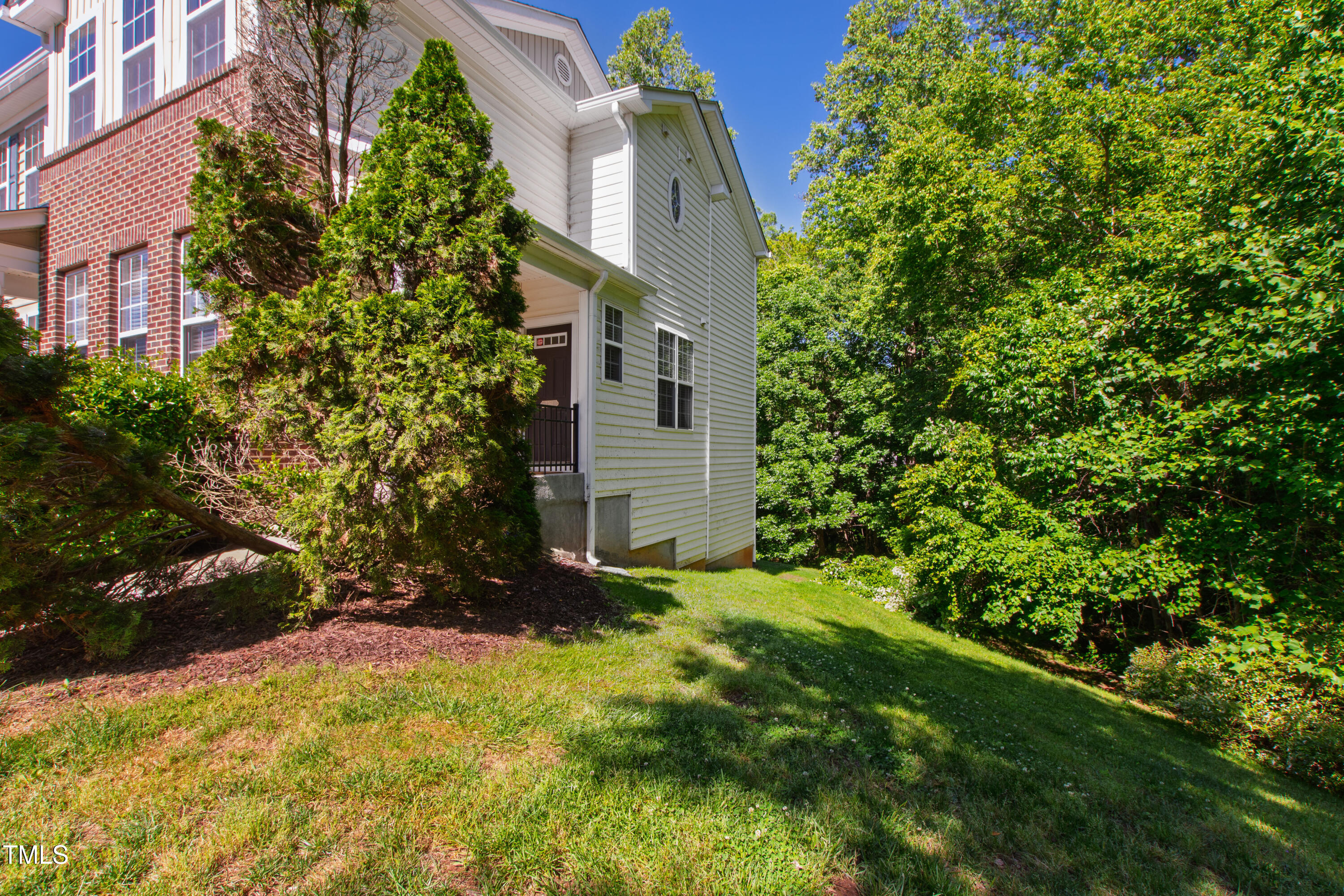 7761 Winners Edge Street Raleigh, NC 27617 - Photo 4 of 44 front view of a house with a tree