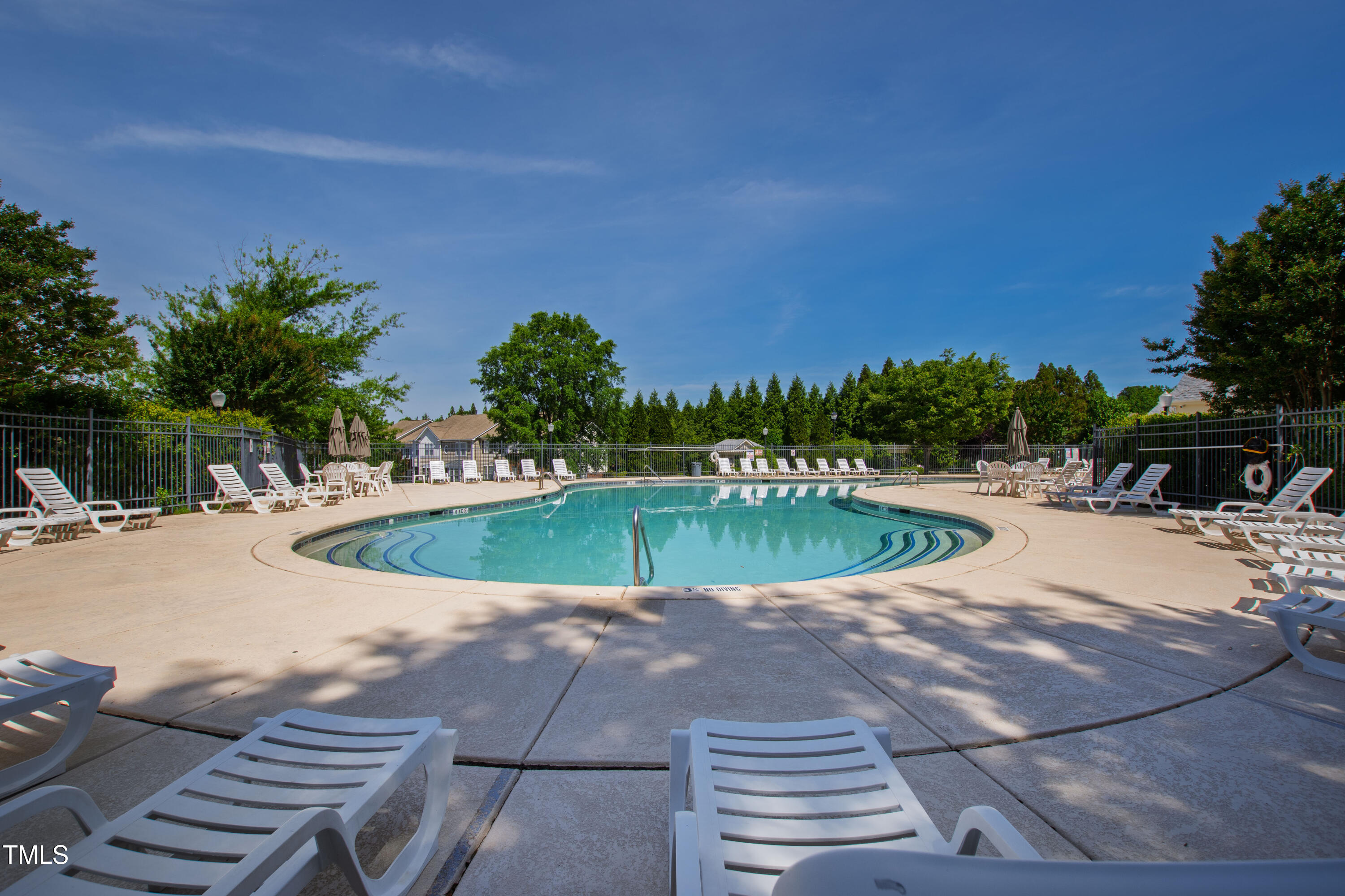 7761 Winners Edge Street Raleigh, NC 27617 - Photo 43 of 44 a view of a swimming pool with a yard