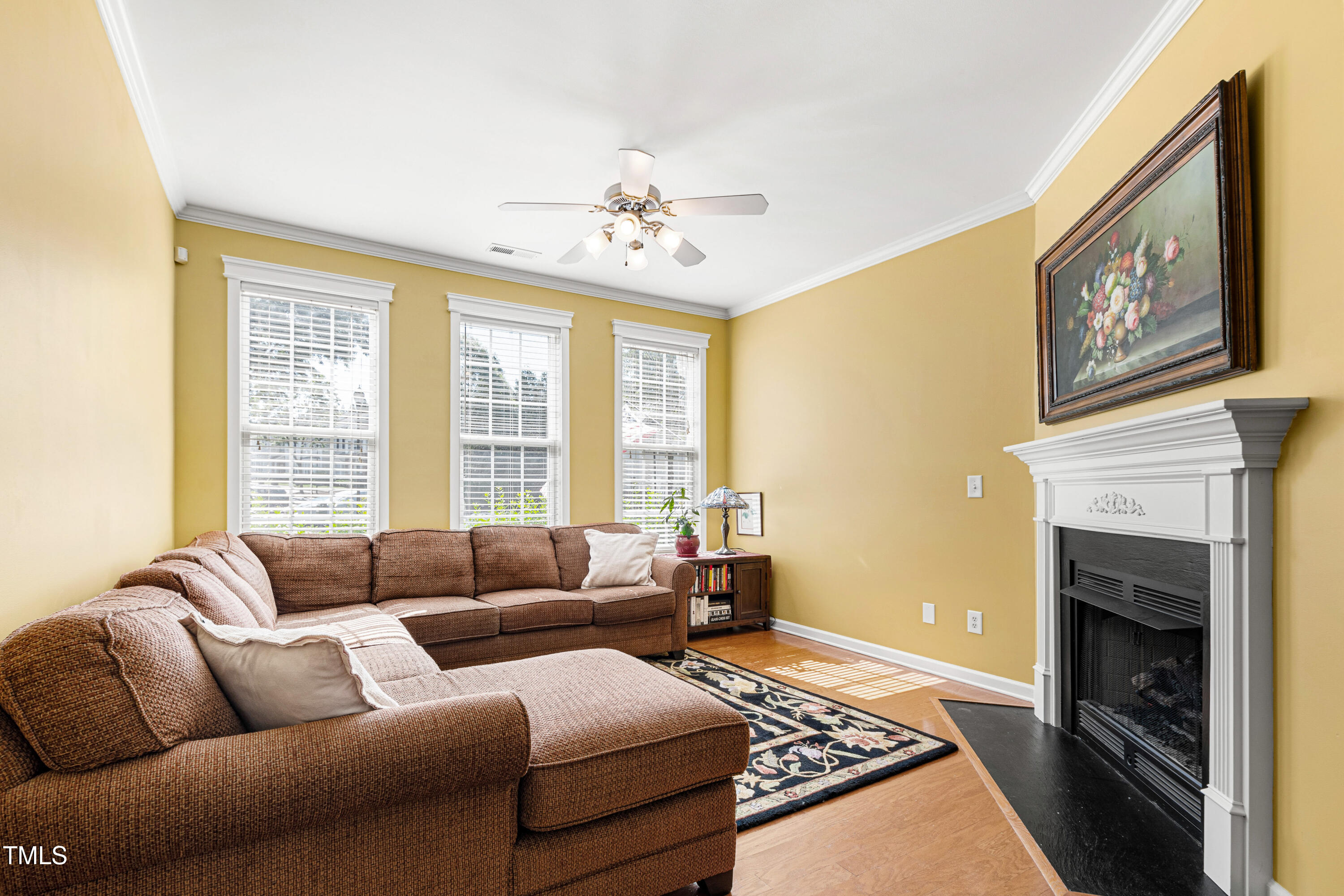 7761 Winners Edge Street Raleigh, NC 27617 - Photo 6 of 44 a living room with furniture and a fireplace
