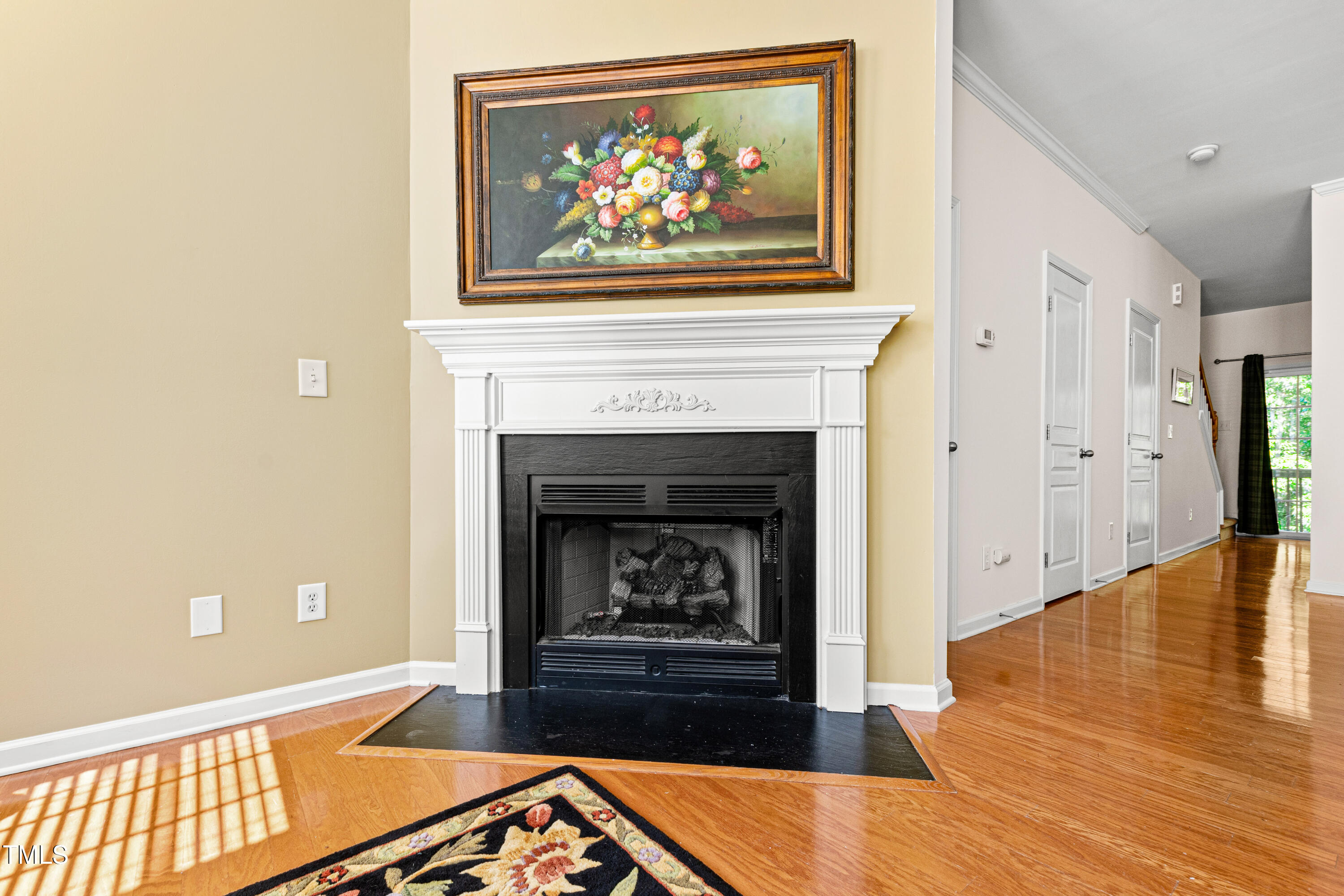 7761 Winners Edge Street Raleigh, NC 27617 - Photo 7 of 44 a living room with furniture and a fireplace