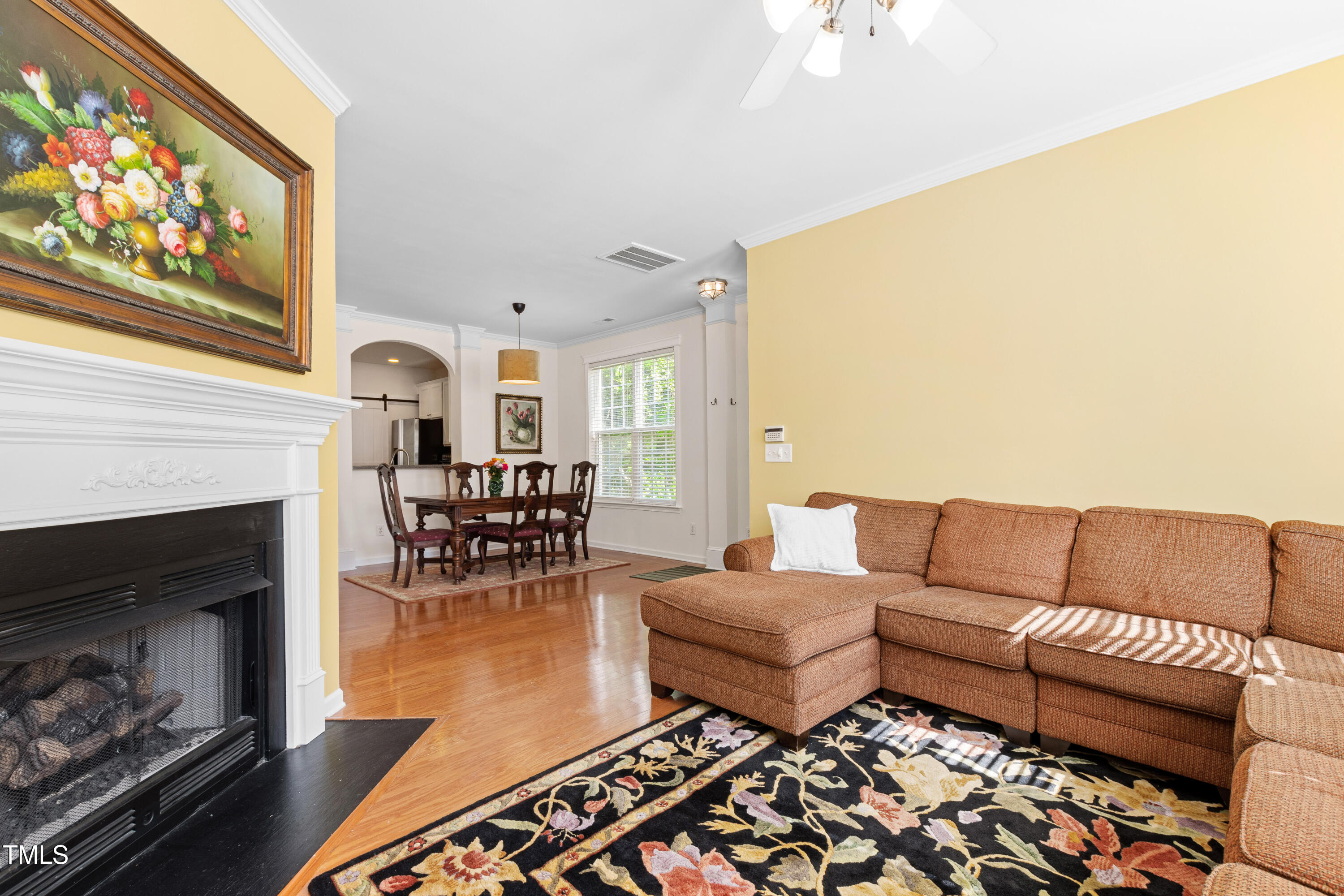 7761 Winners Edge Street Raleigh, NC 27617 - Photo 8 of 44 a living room with furniture and a fireplace