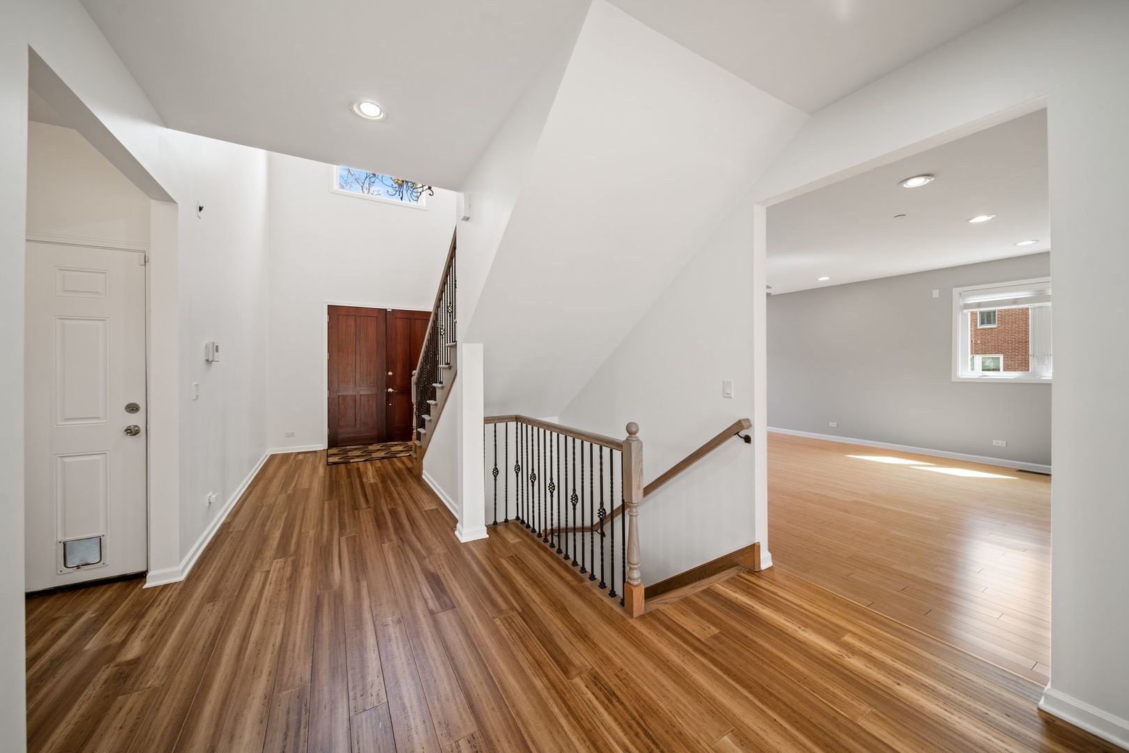 701 Oakton Street Park Ridge, IL 60068 - Photo 7 of 59 a view of hallway with wooden floor and stairs