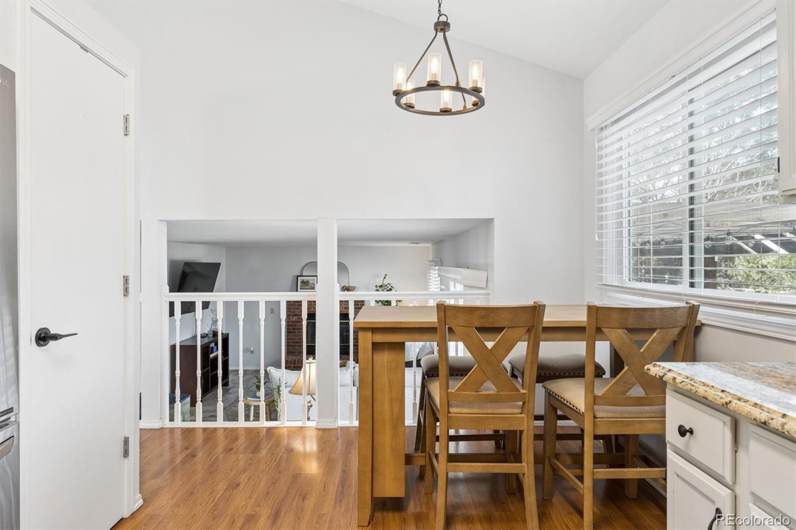 7191 Palisade Drive Highlands Ranch, CO 80130 - Photo 14 of 39 a view of a dining room with furniture window and outside view