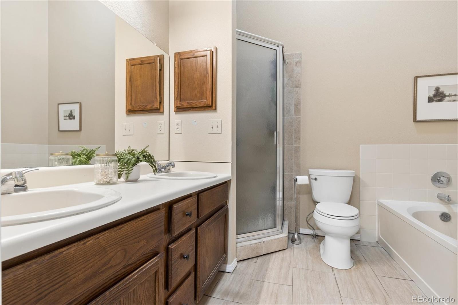 7191 Palisade Drive Highlands Ranch, CO 80130 - Photo 25 of 39 a bathroom with a sink toilet and shower