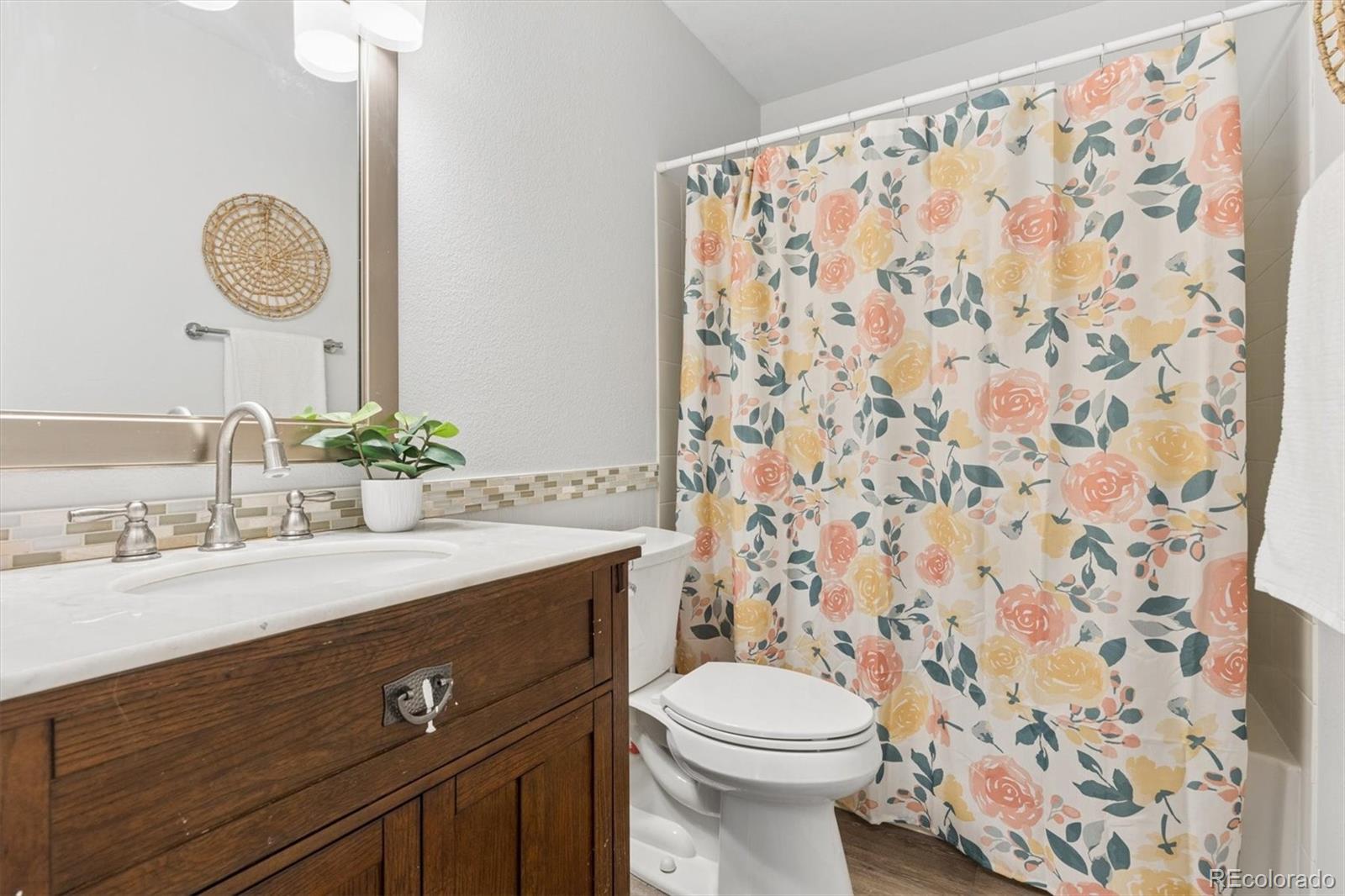 7191 Palisade Drive Highlands Ranch, CO 80130 - Photo 29 of 39 a bathroom with a sink and a mirror