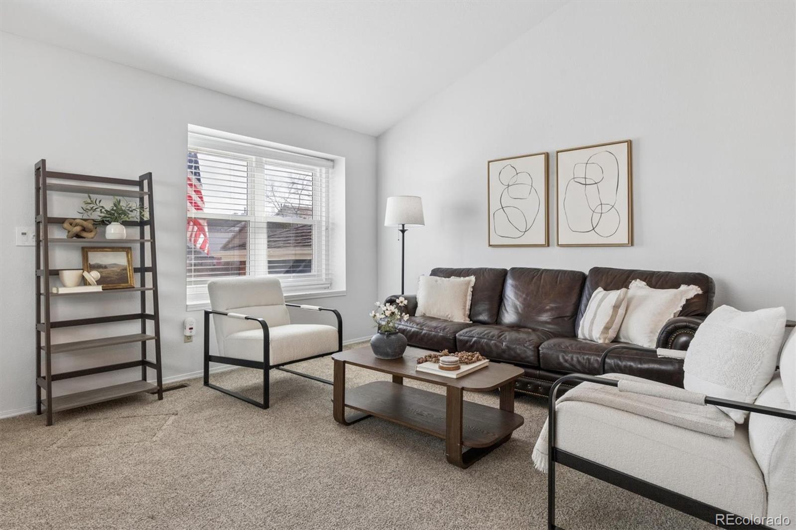 7191 Palisade Drive Highlands Ranch, CO 80130 - Photo 3 of 39 a living room with furniture and a window