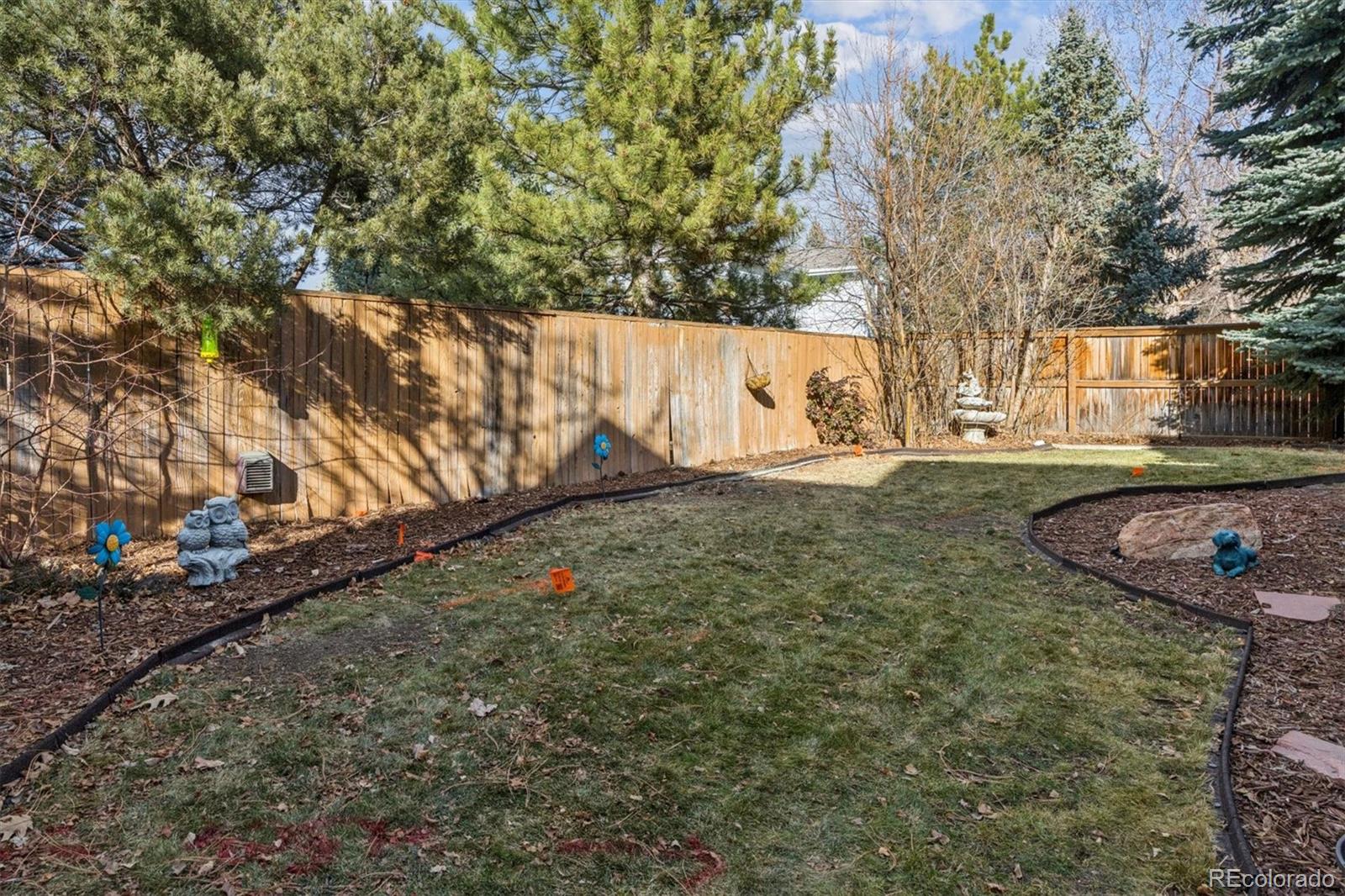 7191 Palisade Drive Highlands Ranch, CO 80130 - Photo 32 of 39 a view of a yard with an tree