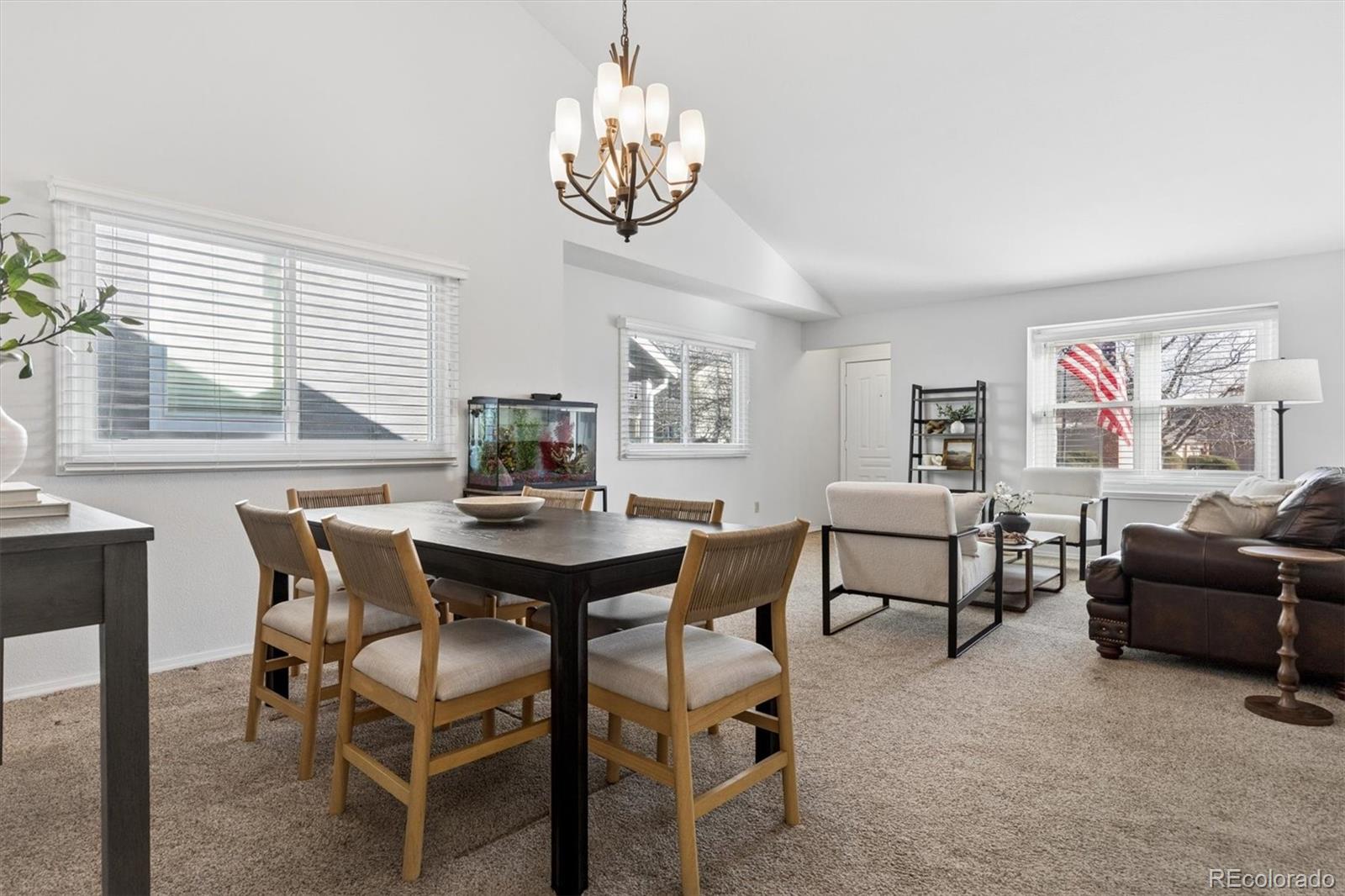 7191 Palisade Drive Highlands Ranch, CO 80130 - Photo 9 of 39 a view of a dining room with furniture and chandelier