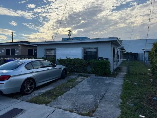 a car parked in front of a house