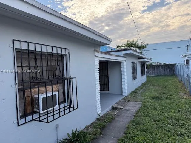 a view of a porch with a small yard