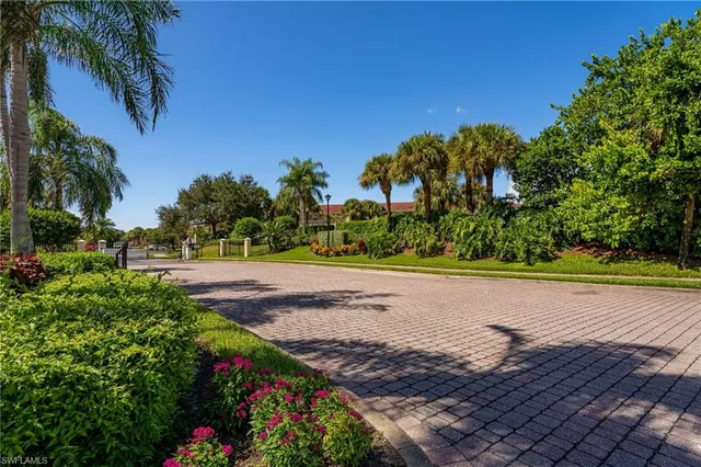 a view of a yard with flower garden