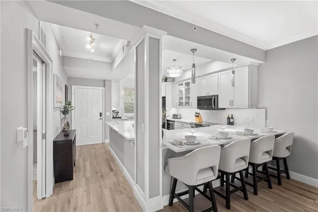 a dining table with chairs and wooden floor