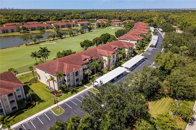 an aerial view of a house with a lake view